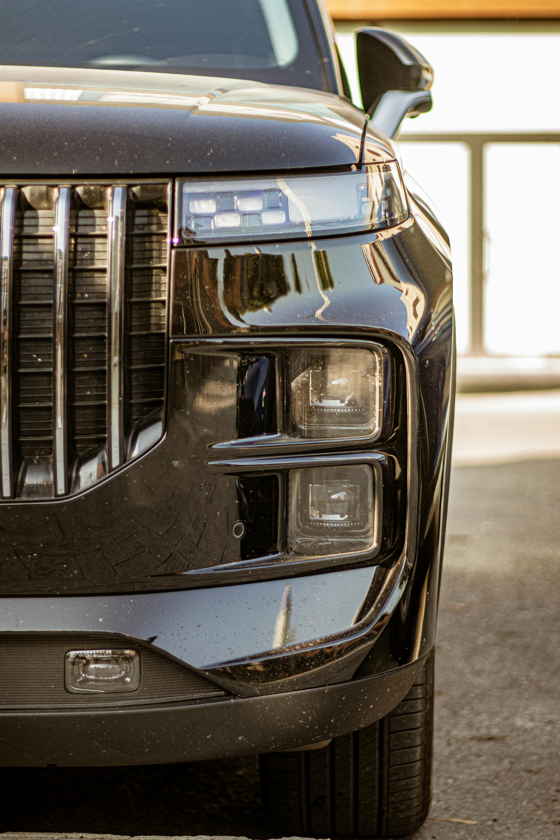 A close-up shot of a black SUV on the road | Source: Pexels