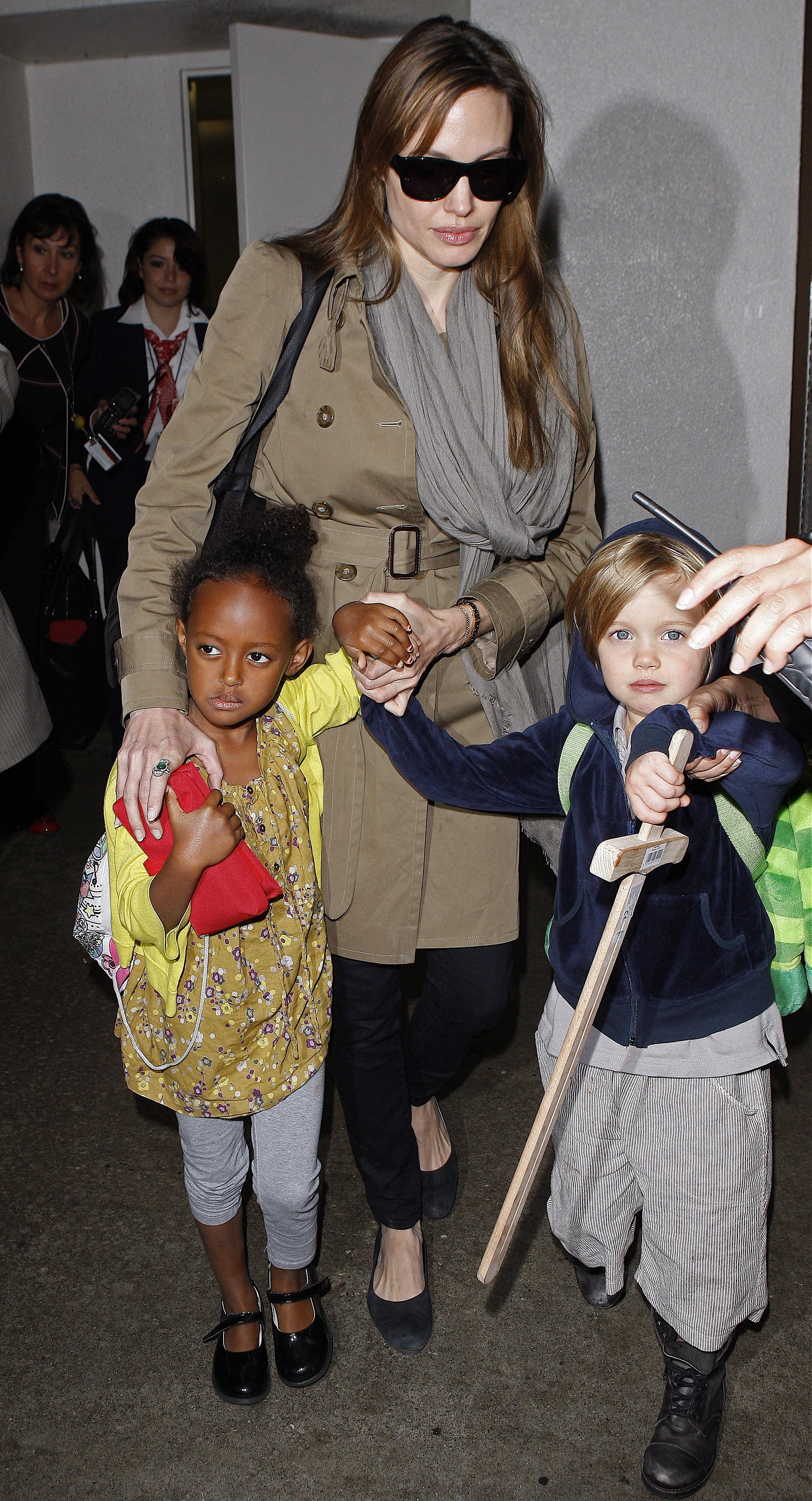 Angelina Jolie and daughters Zahara and Shiloh at LAX Airport in Los Angeles, California on September 18, 2010 | Source: Getty Images