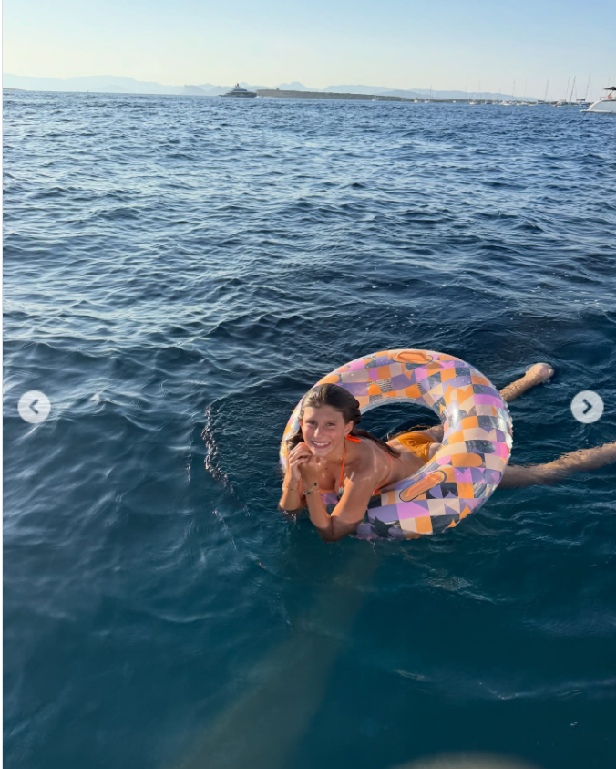 A young Vivian Brady is captured with a float around her body, as seen from a post dated December 5, 2025. | Source: Instagram/tombrady