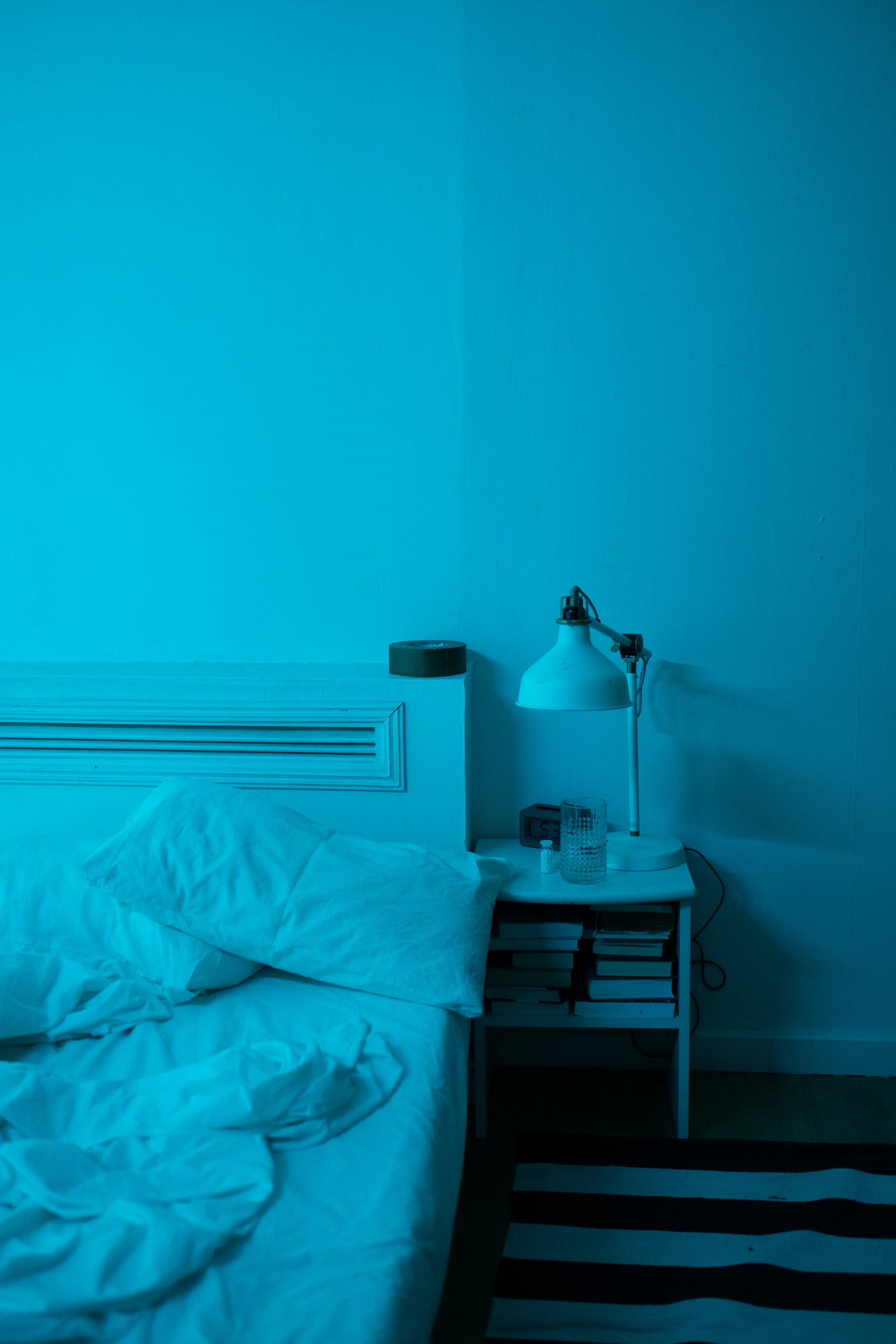 Empty bed at night | Source: Pexels