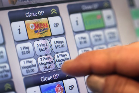 A customer purchases a Mega Millions lottery ticket. | Photo: Getty Images