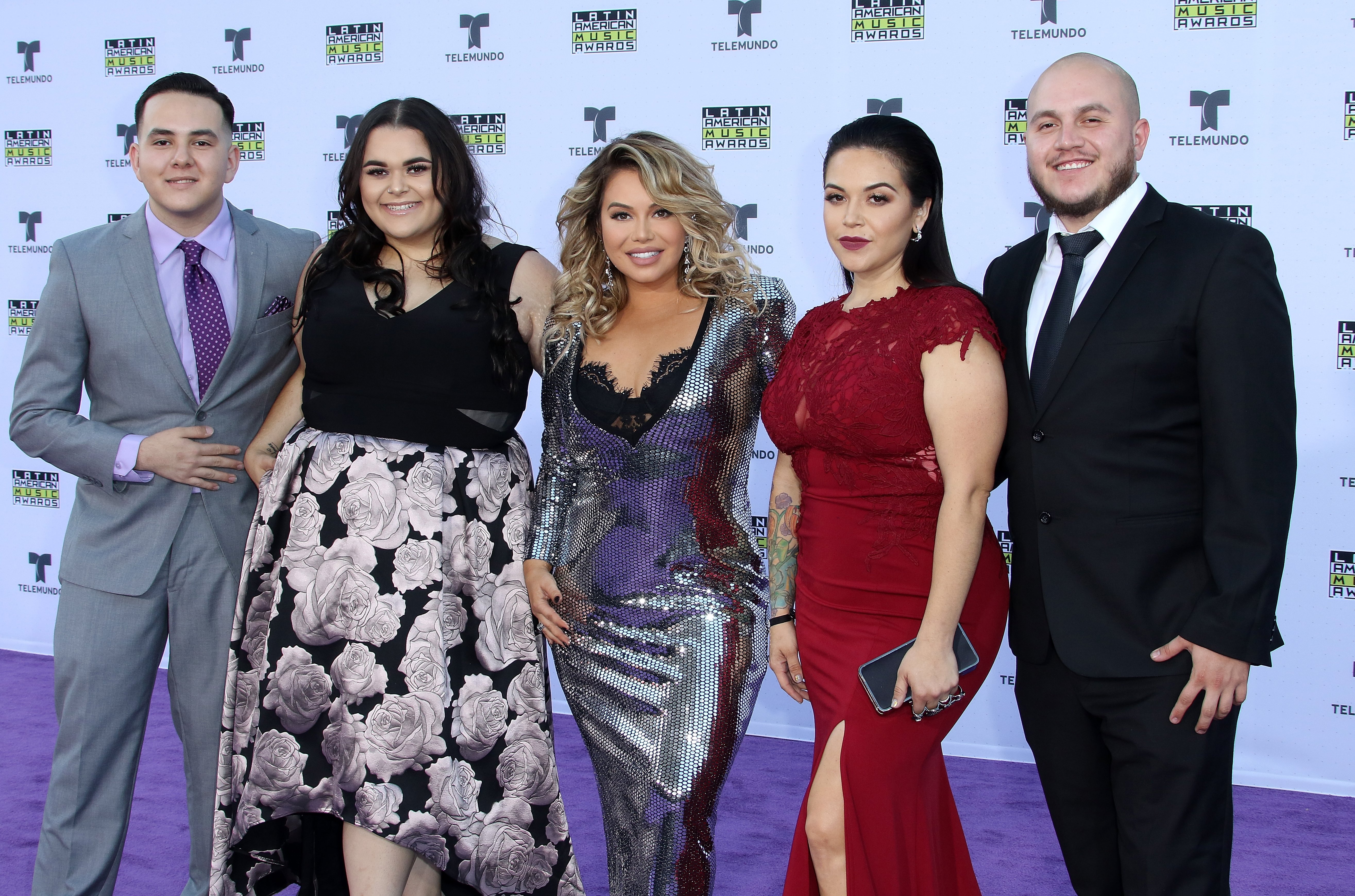 (L-R) Johnny Lopez, Jenicka Lopez, Chiquis Rivera, Jacqie Campos, Michael Marin attend The 2017 Latin American Music Awards at Dolby Theatre on October 25, 2017 in Hollywood, California. | Source: Getty Images