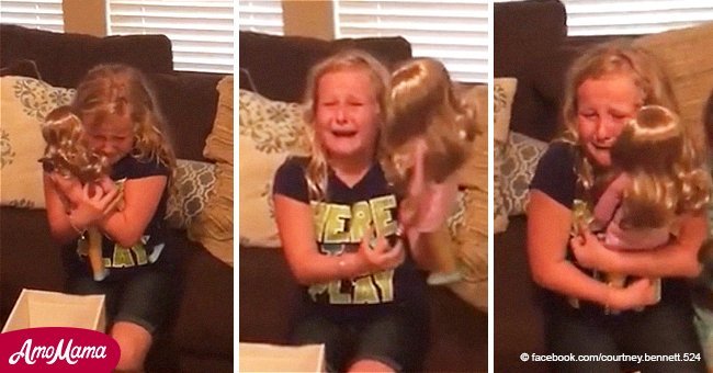 Girl with prosthetic leg bursts into tears when she gets a doll that looks just like her