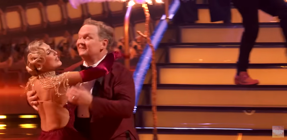 Andy Richter and Emma Slater on the dance floor, as seen from a video post dated November 12, 2025. | Source: YouTube/ DancingWithTheStars