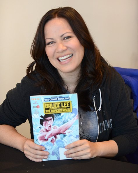 Martial Artist/actress Shannon Lee signs copies of her comicbook "Bruce Lee: The Dragon Rise" | Photo: Getty Images