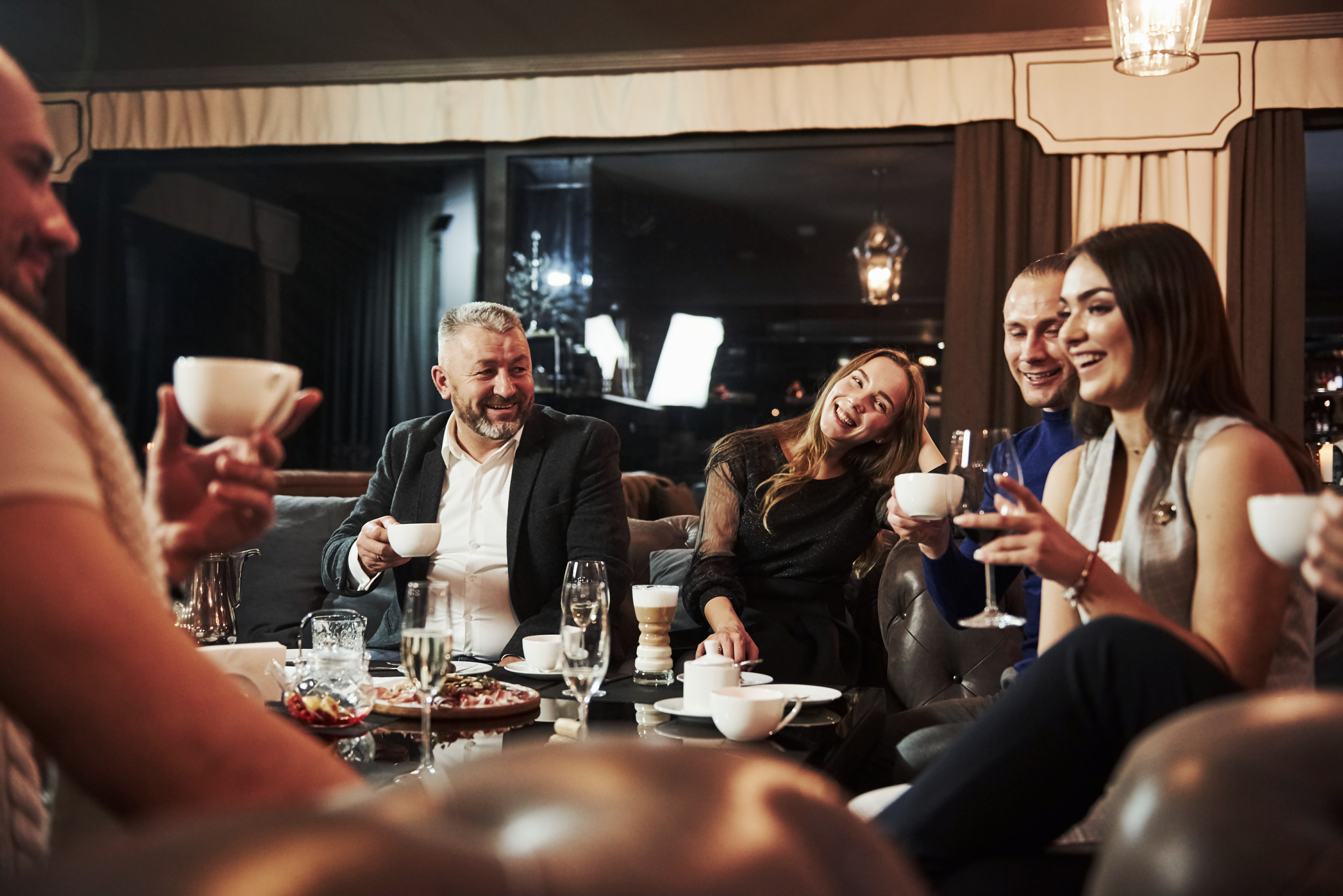 People laughing and celebrating | Source: Shutterstock