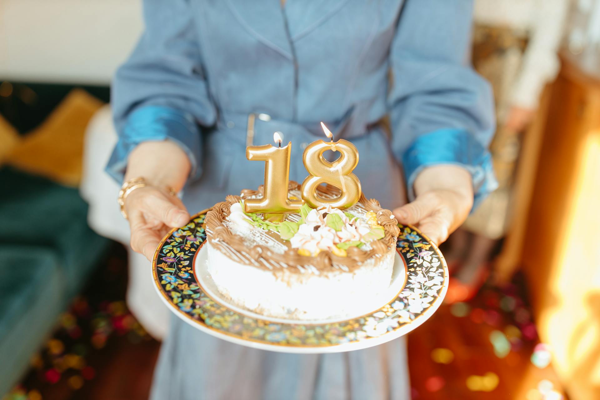 Close-up shot of a woman holding a birthday cake | Source: Pexels