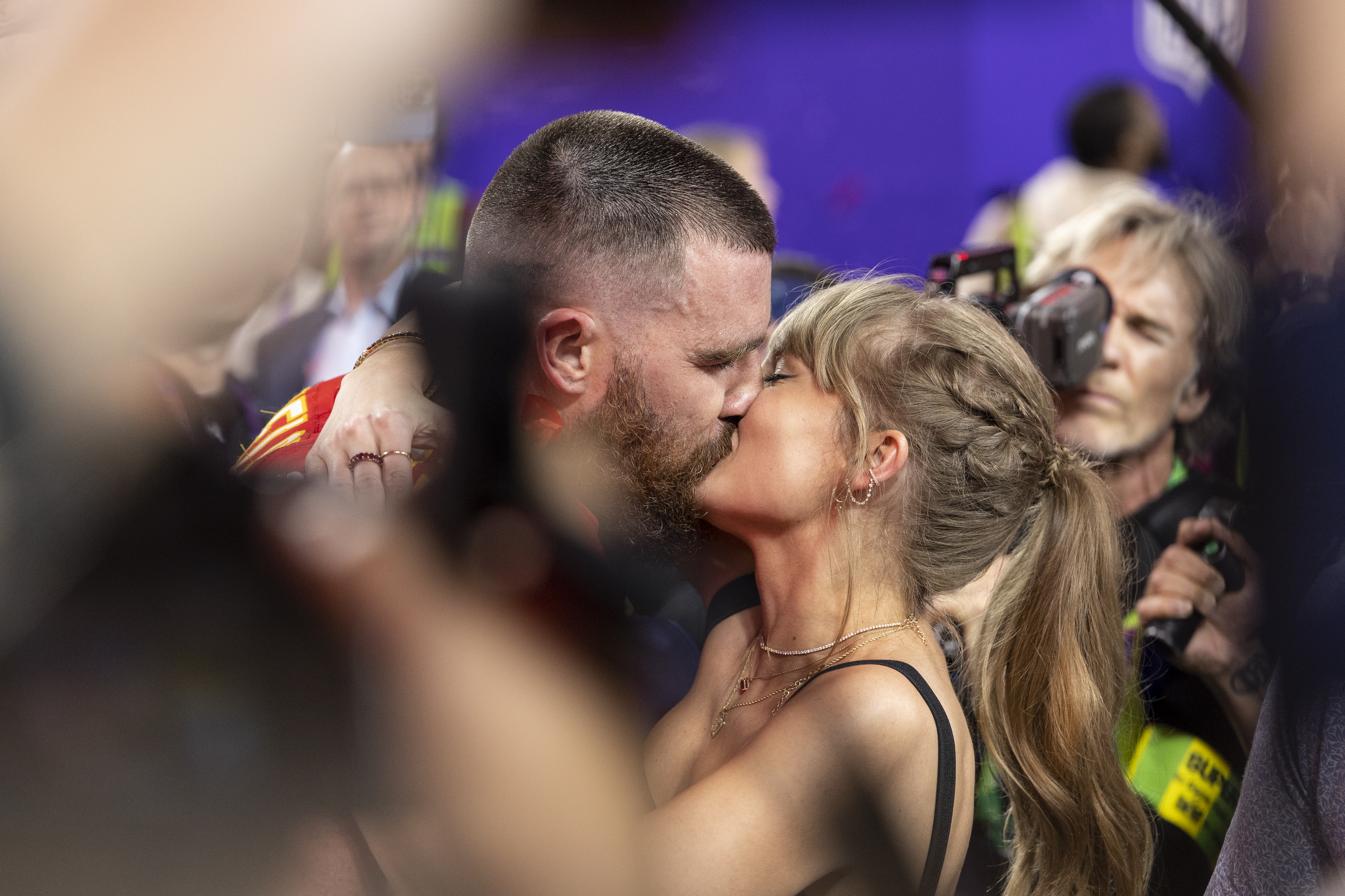 Travis Kelce and Taylor Swift sharing a kiss after the NFL Super Bowl 58 game between the Kansas City Chiefs and the San Francisco 49ers at Allegiant Stadium in Las Vegas, Nevada, on February 11, 2024 | Source: Getty Images