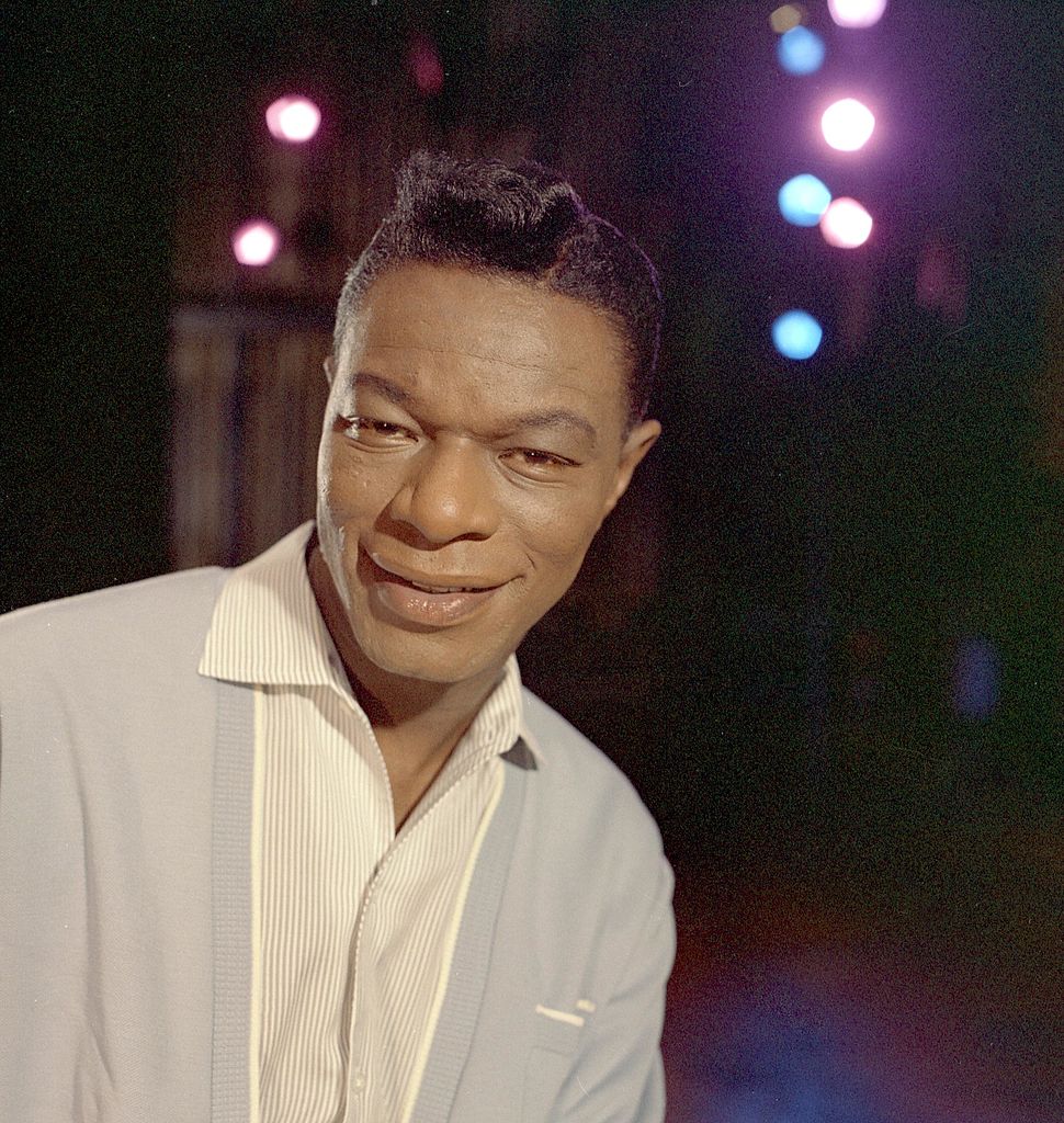 Singer Nat "King" Cole records during a session in the Capitol Recording Studios in circa 1964 | Photo: Getty Images