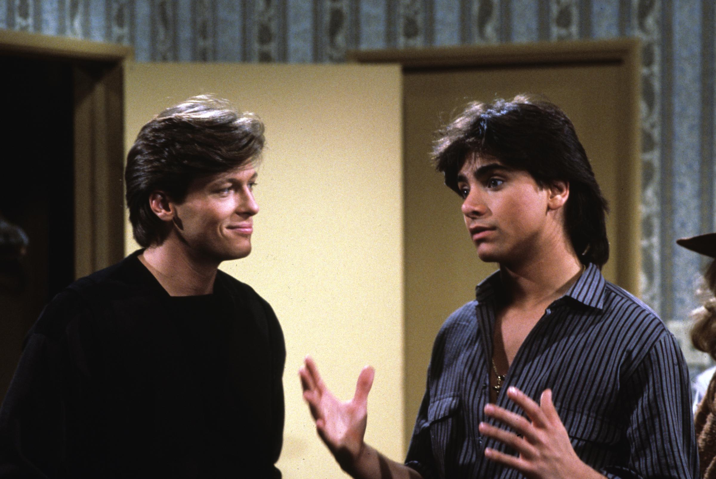 The actor and John Stamos pictured on the set of "General Hospital," 1983 | Source: Getty Images