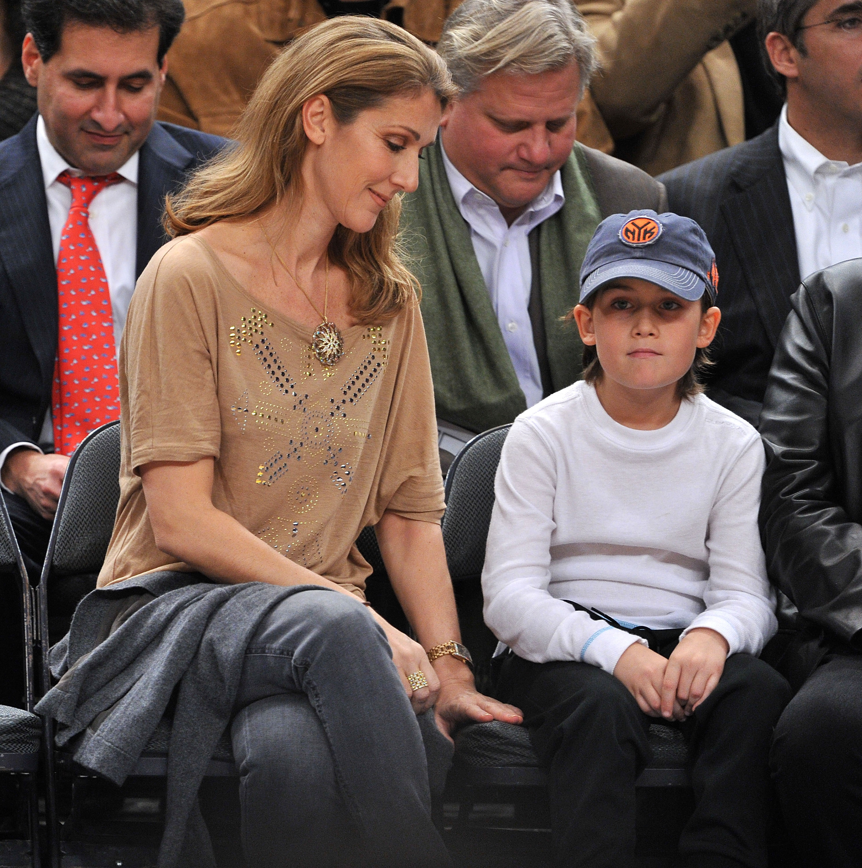 Céline Dion and René-Charles Angélil at a game at Madison Square Garden on December 7, 2009, in New York City | Source: Getty Images