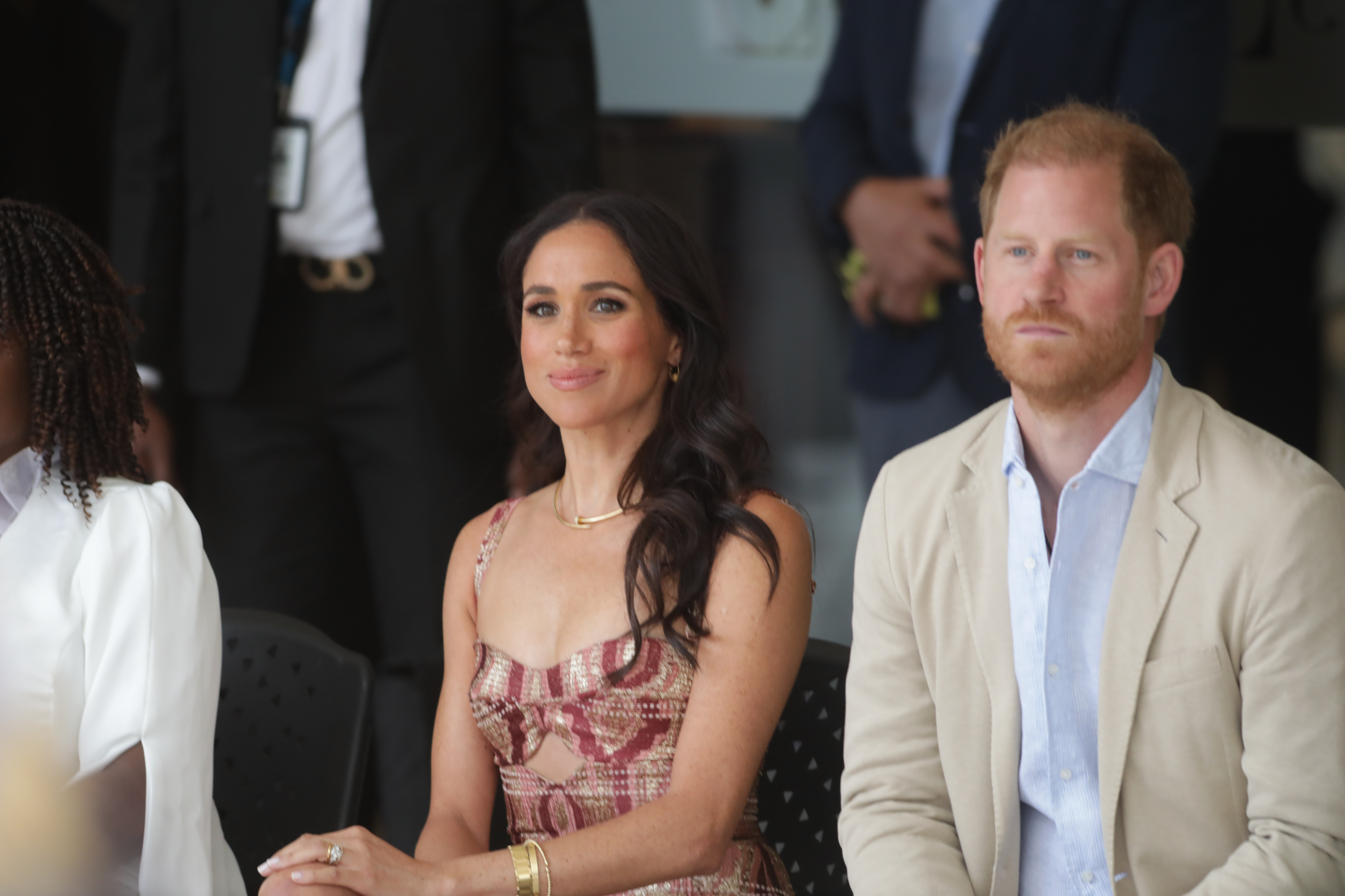 Meghan Markle smiles while Prince Harry looks on during their trip to Bogotá, Colombia, on August 15, 2024 | Source: Getty Images