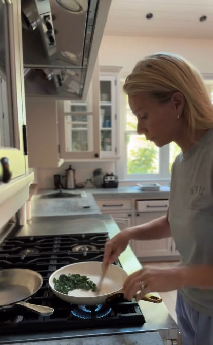 Gwyneth Paltrow sauteing greens for her Korean breakfast take on her video, dated July 19, 2025 | Source: Instagram/gwynethpaltrow