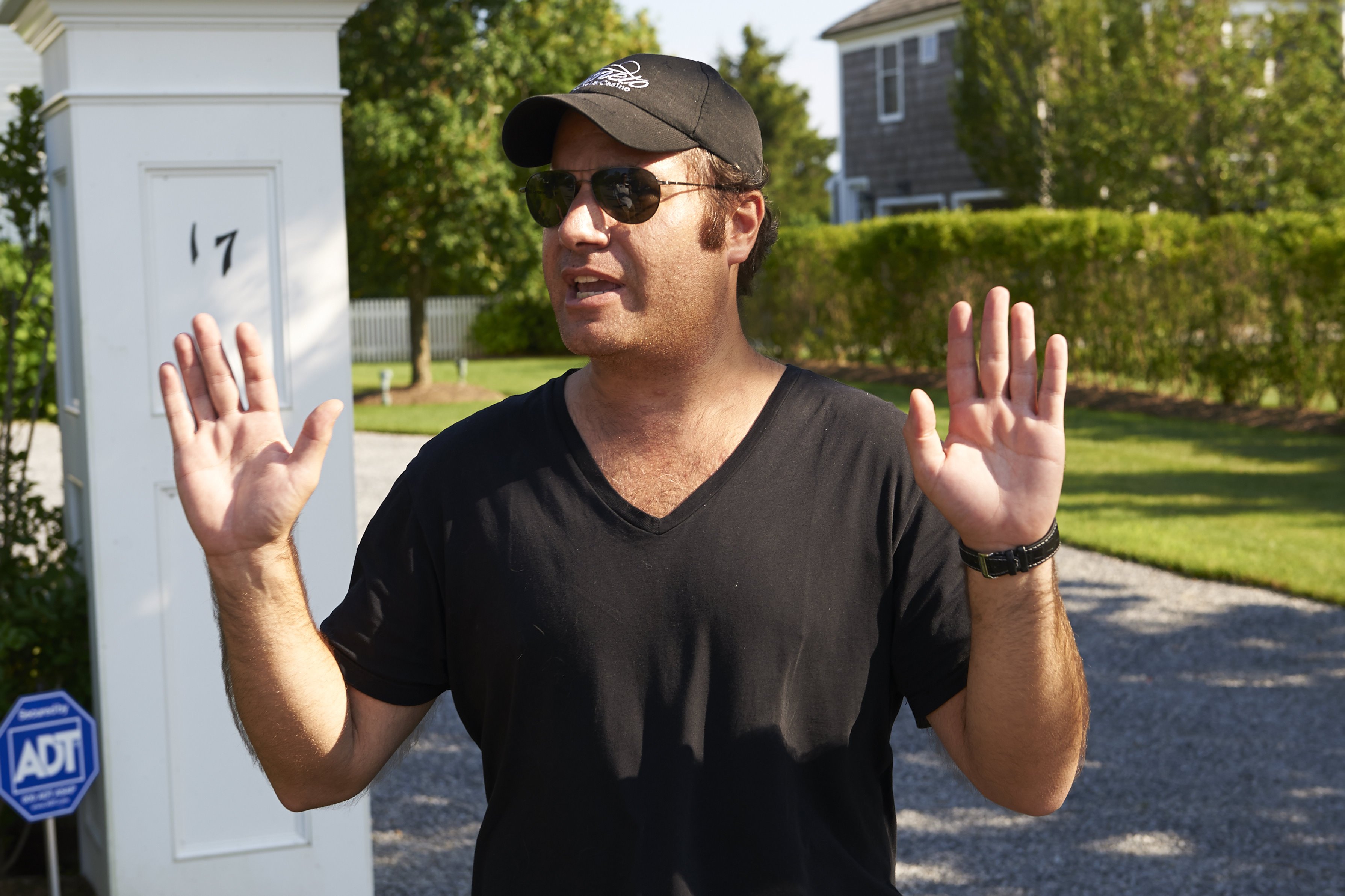 Andrew Silverman speaking to the media after returning to the house he and his wife Lauren Silverman rent every year in Bridgehampton, New York, on August 2, 2013 | Source: Getty Images