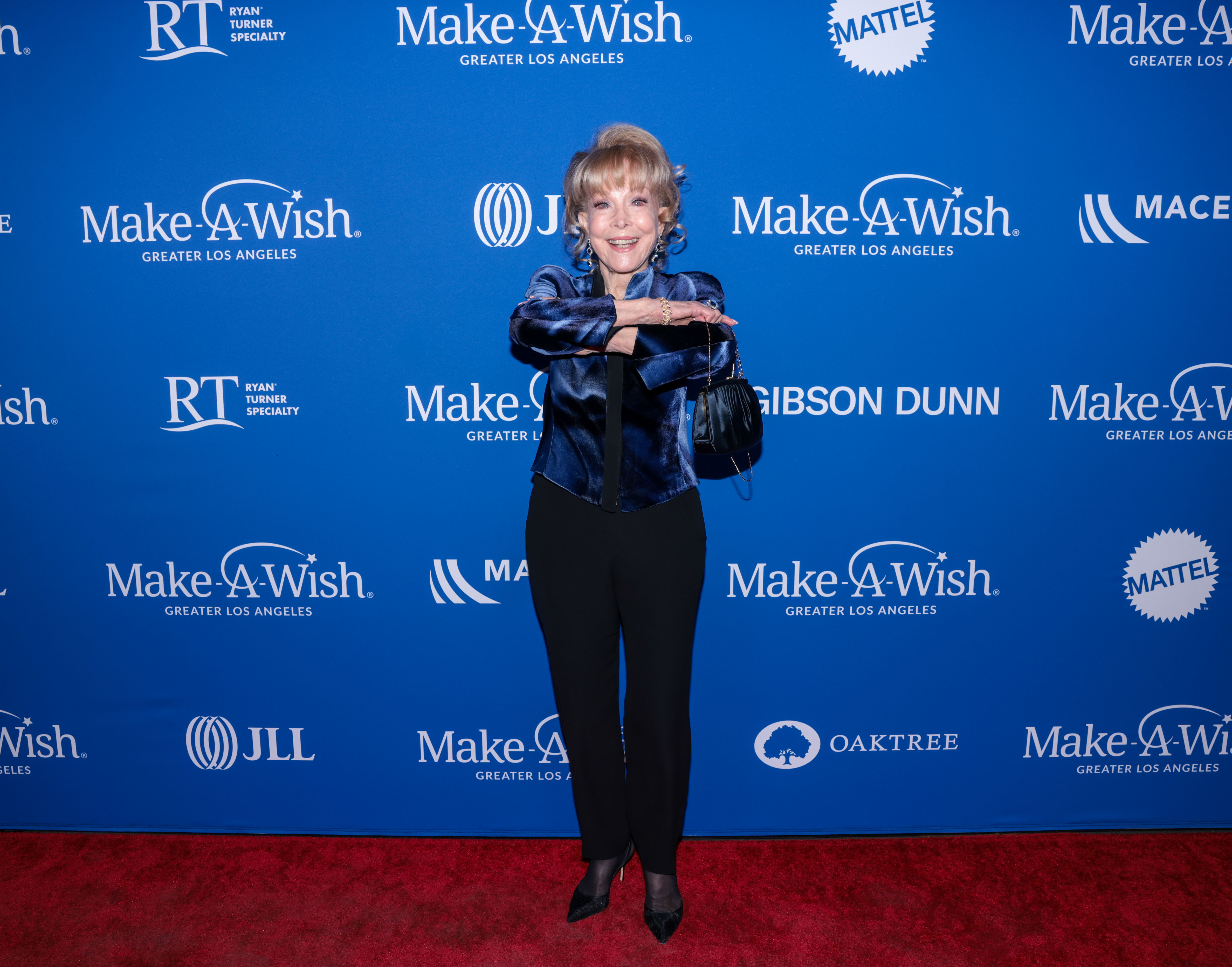 Barbara Eden poses with her arms covering her chest at Make-A-Wish Greater LA's Wish Gala on November 19, 2022, in Hollywood, California. | Source: Getty Images