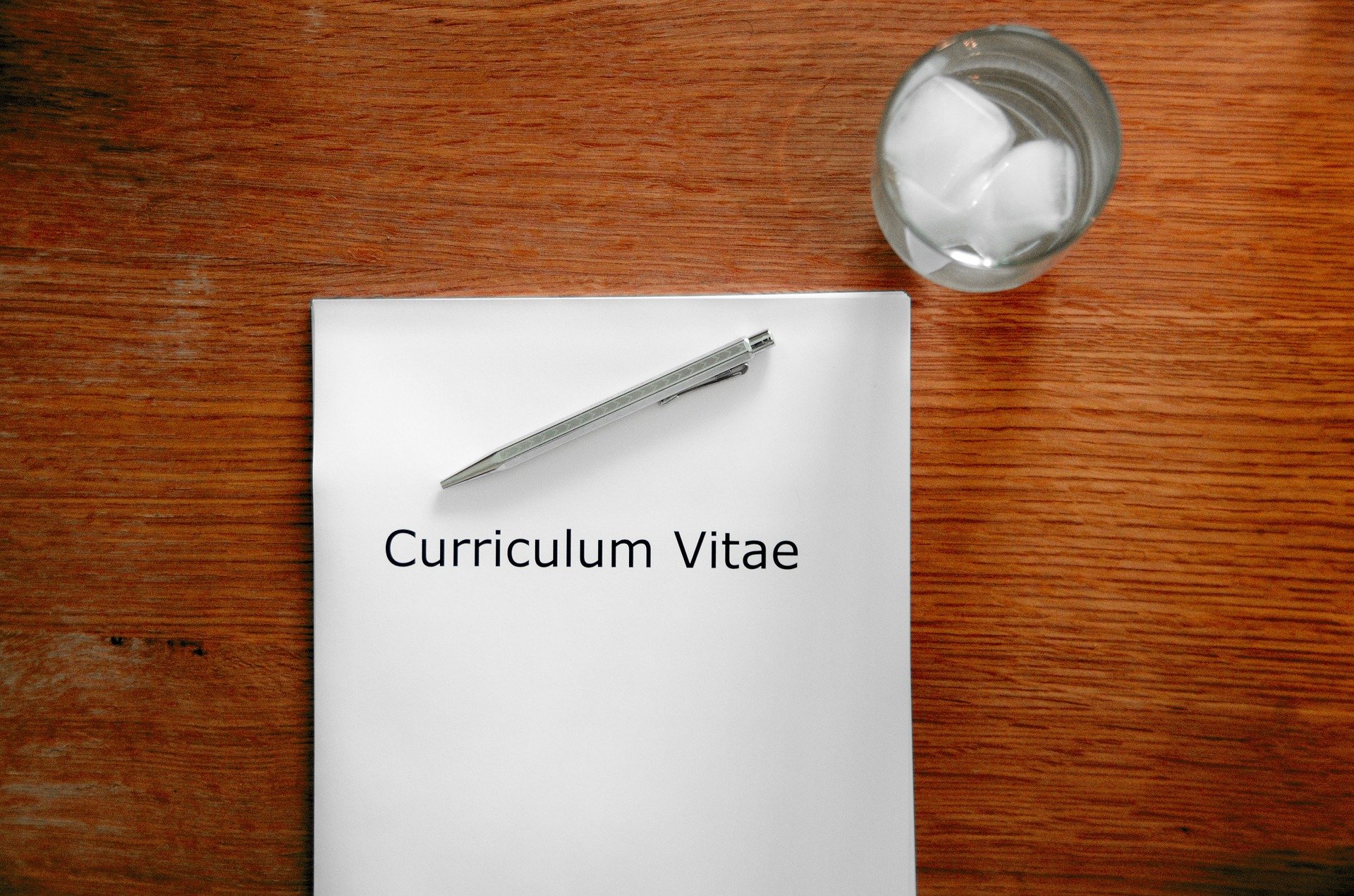 Pictured - A Curriculum Vitae on top a desk during a interview | Source: Pixabay