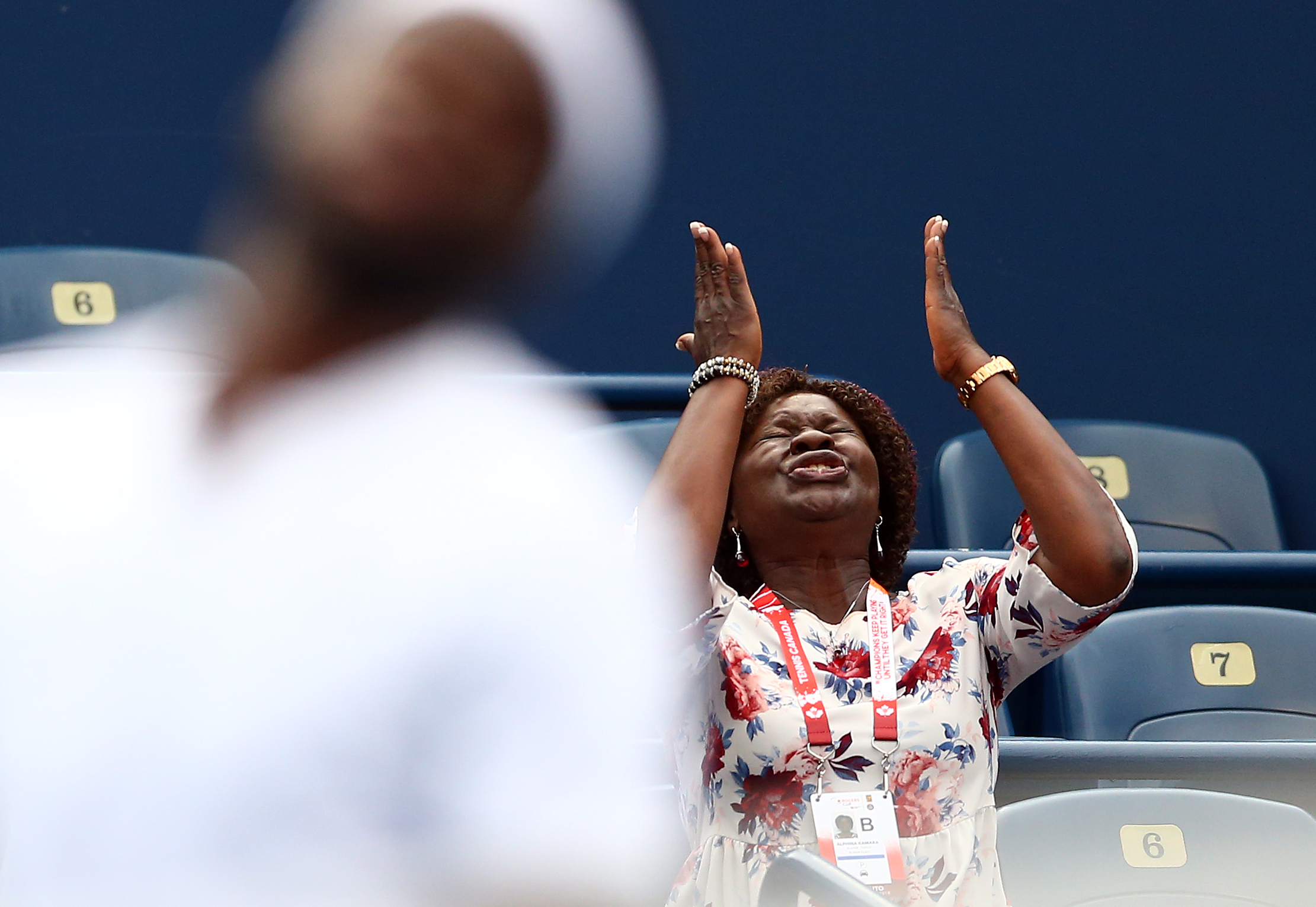 Alphina Kamara reacts after Frances Tiafoe missed a shot against Milos Raonic of Canada during a 2nd round match on Day 3 of the Rogers Cup at Aviva Centre on August 8, 2018, in Toronto, Canada. | Source: Getty Images