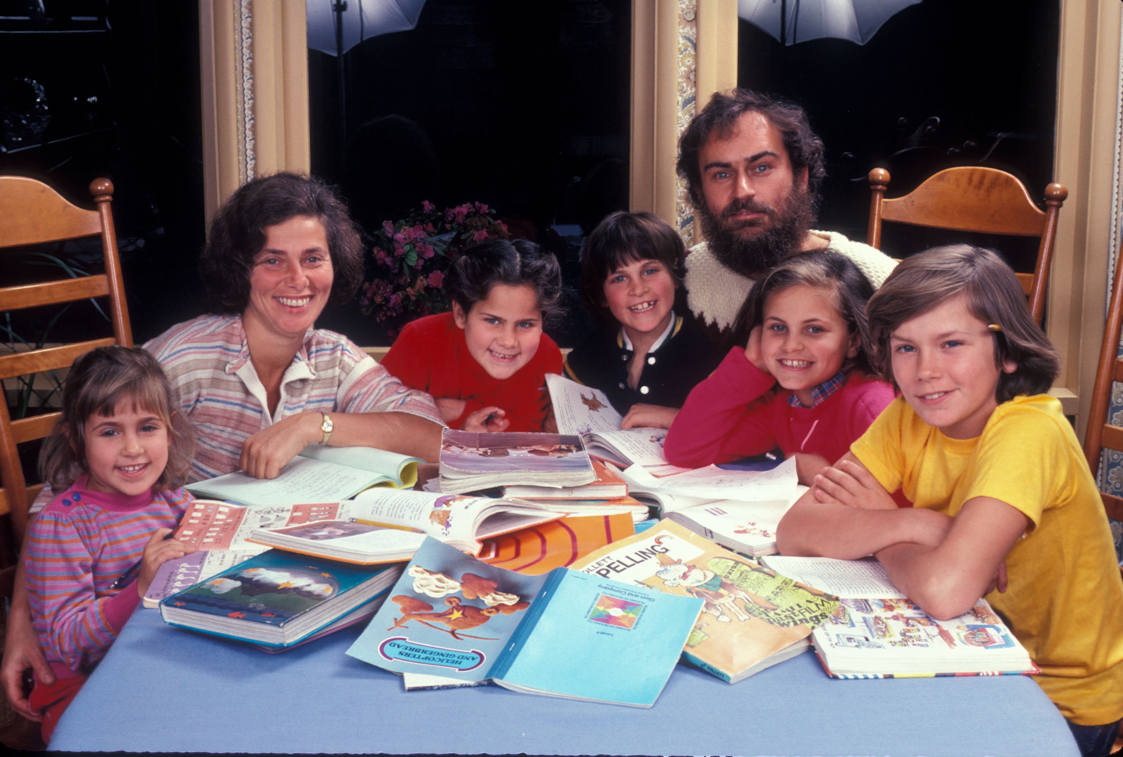 The Phoenix Family at home in Los Angeles, California, US, circa 1983; (from left to right) Summer, Arlyn, Rain, Joaquin, John Lee , Liberty and River Phoenix | Source: Getty Images
