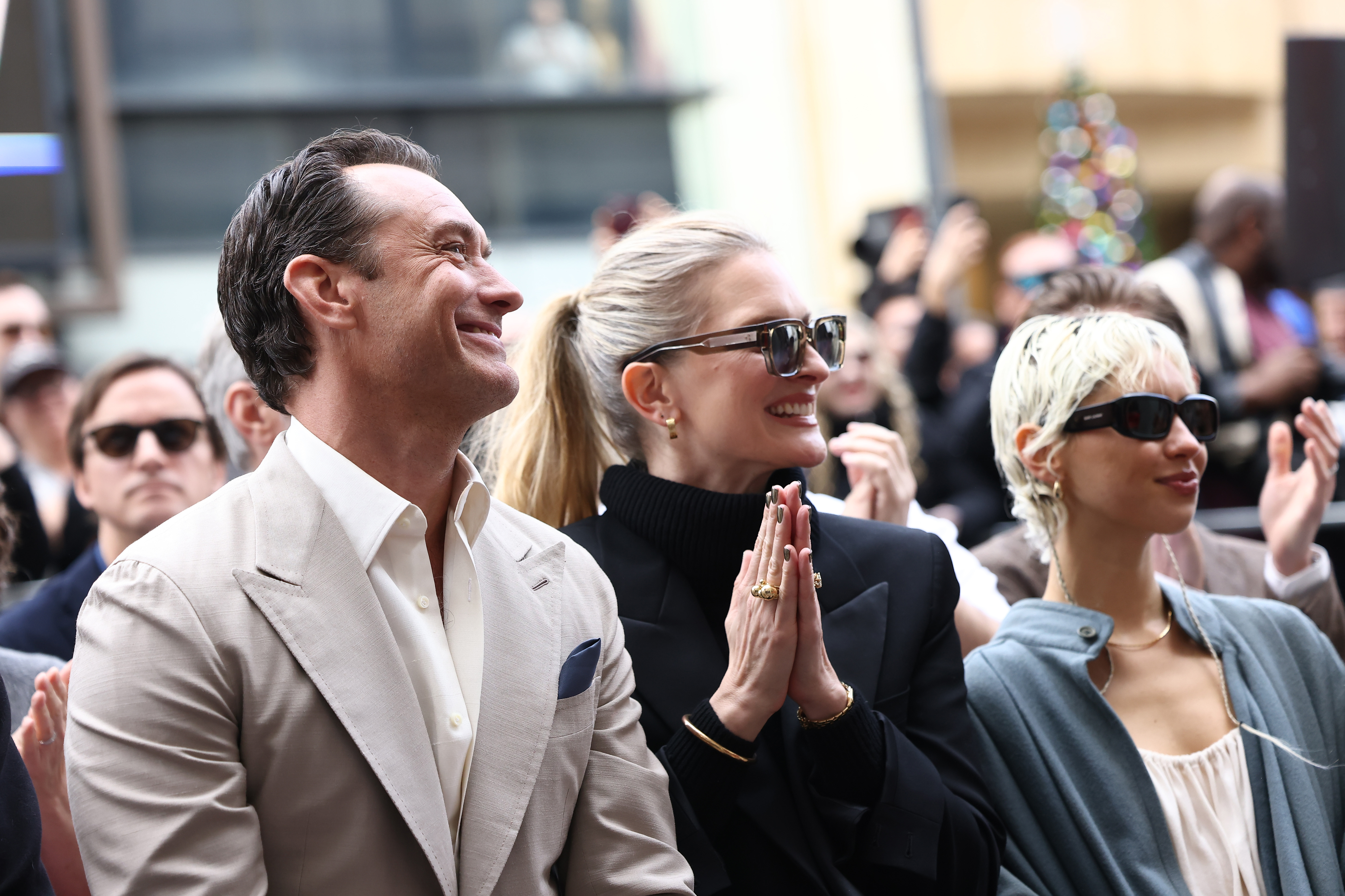 Jude Law, Phillipa Coan and Iris Law attend Jude Law's Hollywood Walk of Fame Star Ceremony on December 12, 2024 | Source: Getty Images