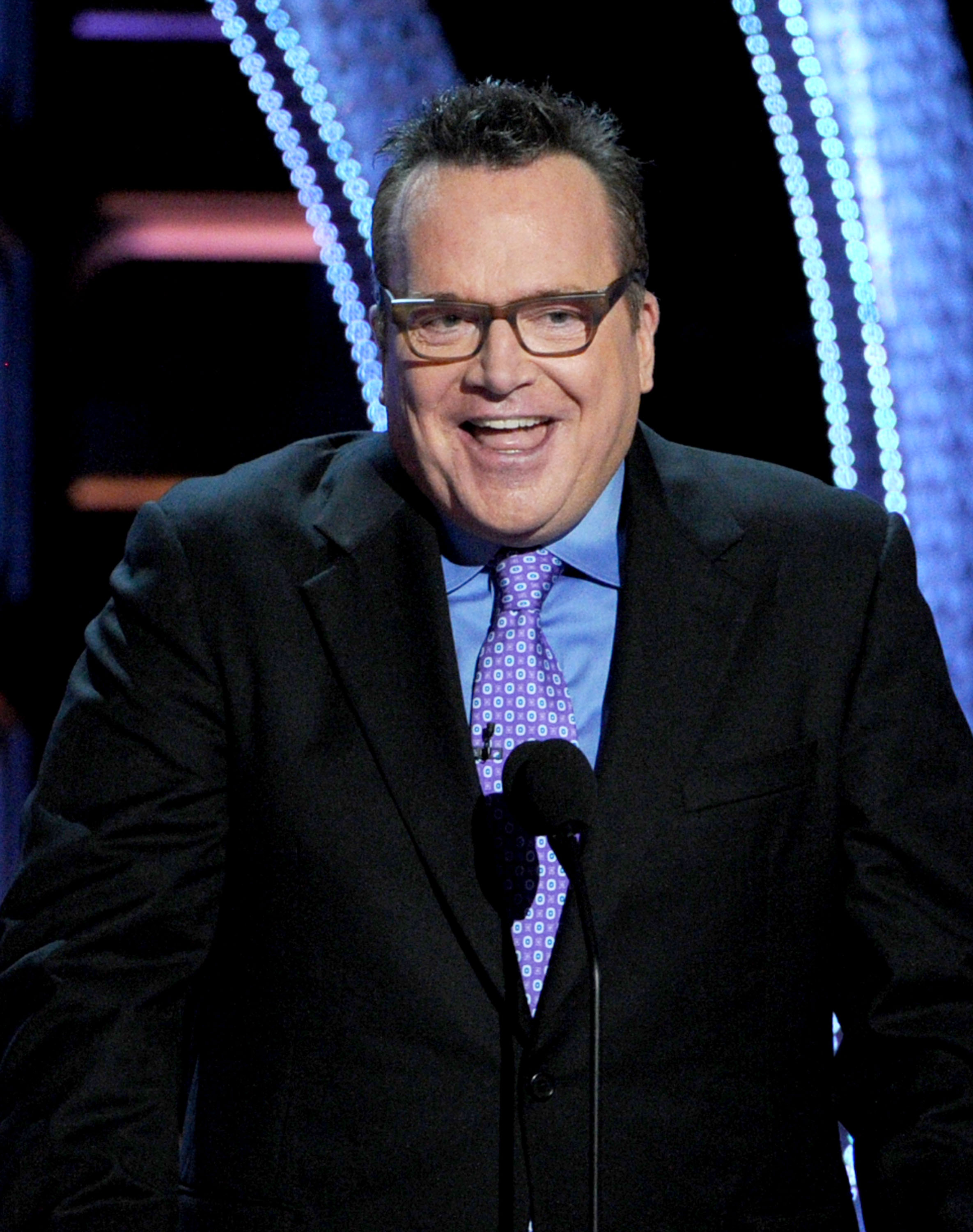 Actor Tom Arnold speaks onstage during the Comedy Central Roast of Roseanne Barr at Hollywood Palladium on August 4, 2012 in Hollywood, California. | Source: Getty Images