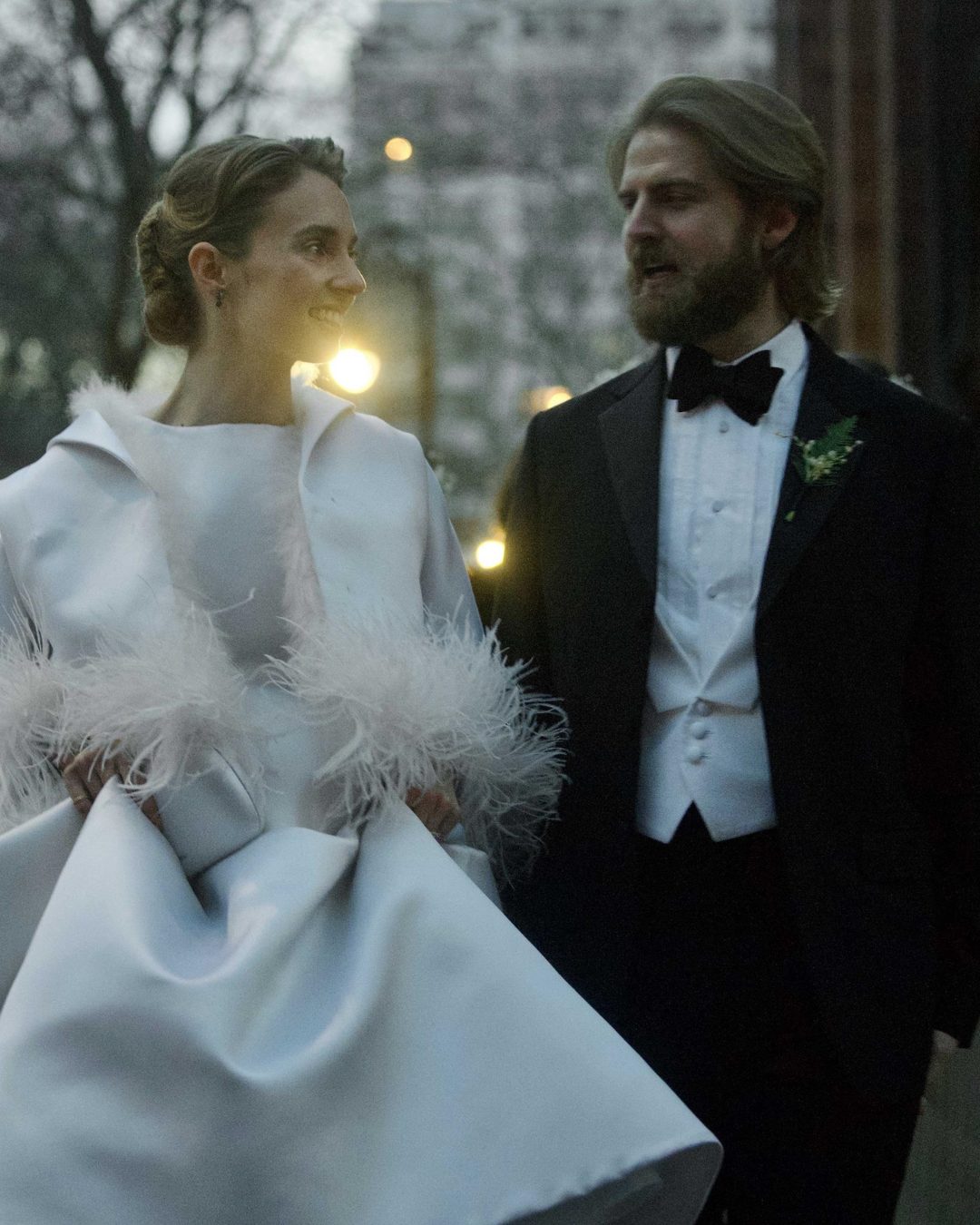 Framed by soft light and sculpted satin, Maya shared a knowing smile with Christian that said everything. In that still moment, her expression radiant with warmth and affection, she carried the entire mood of the day. | Source: Instagram/pagesix