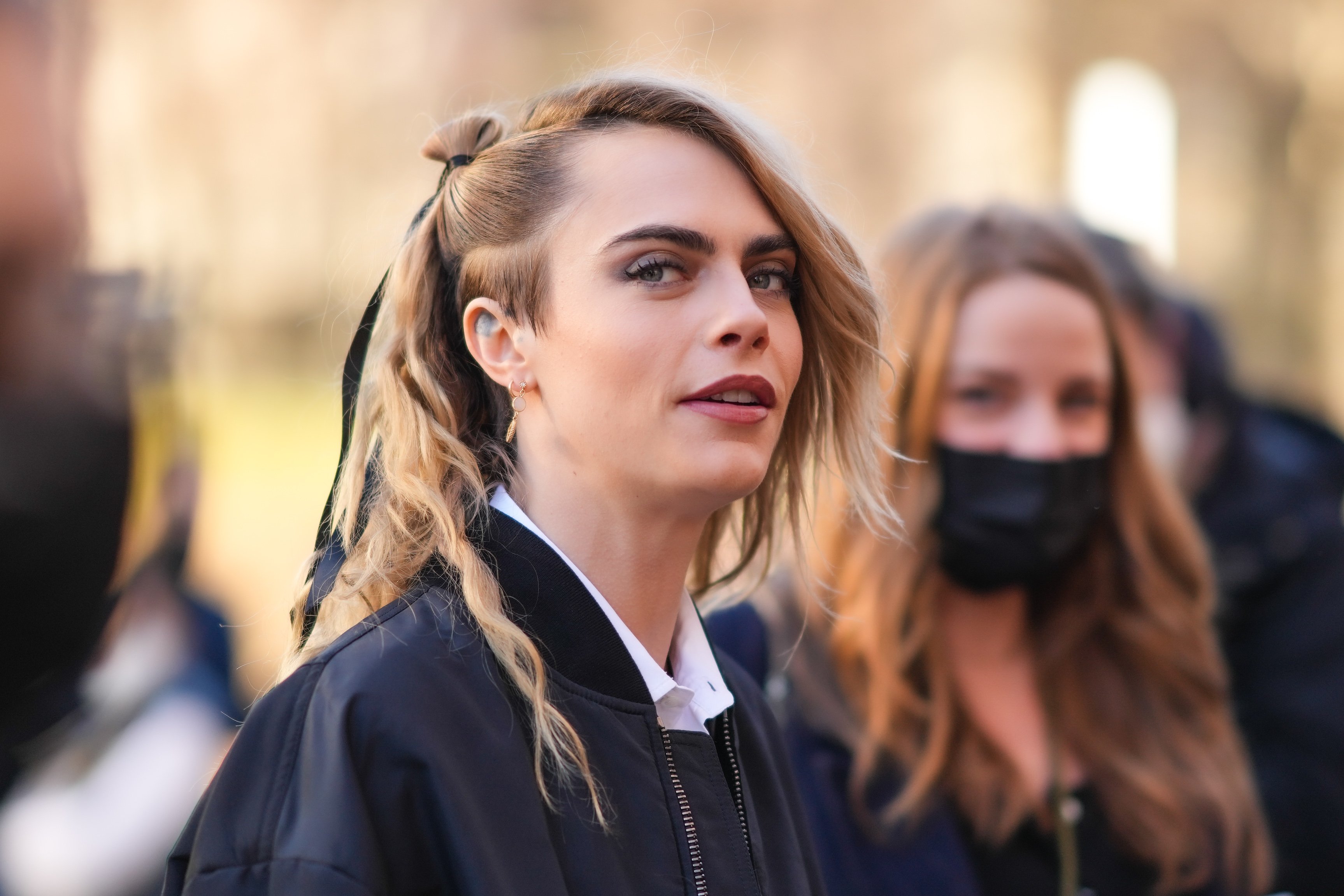 Cara Delevingne is seen, outside Dior, during Paris Fashion Week on January 24, 2022 in Paris, France | Source: Getty Images