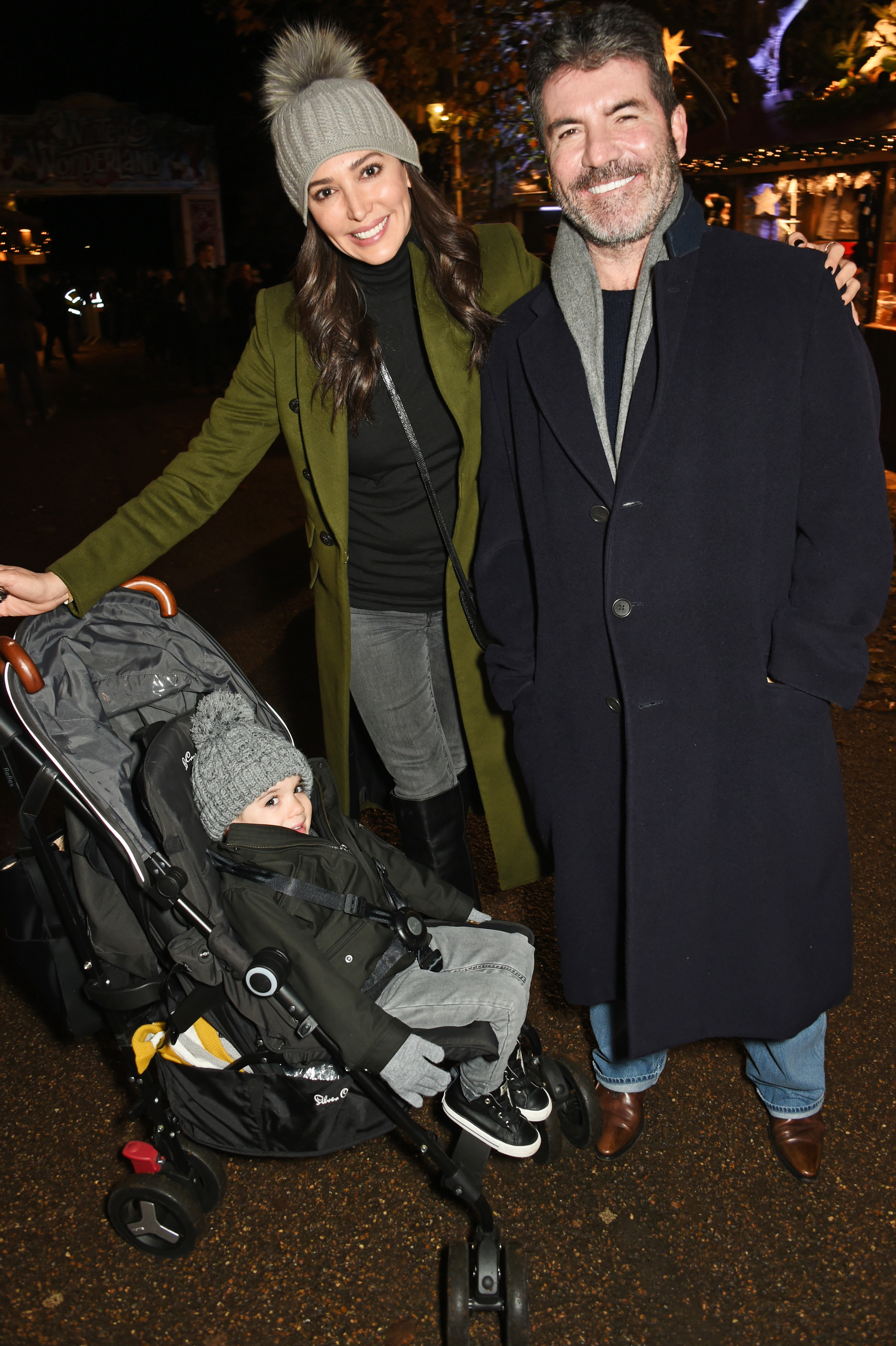 Eric Cowell, Lauren Silverman, and Simon Cowell at a VIP preview of Hyde Park's Winter Wonderland on November 17, 2016, in London, United Kingdom | Source: Getty Images