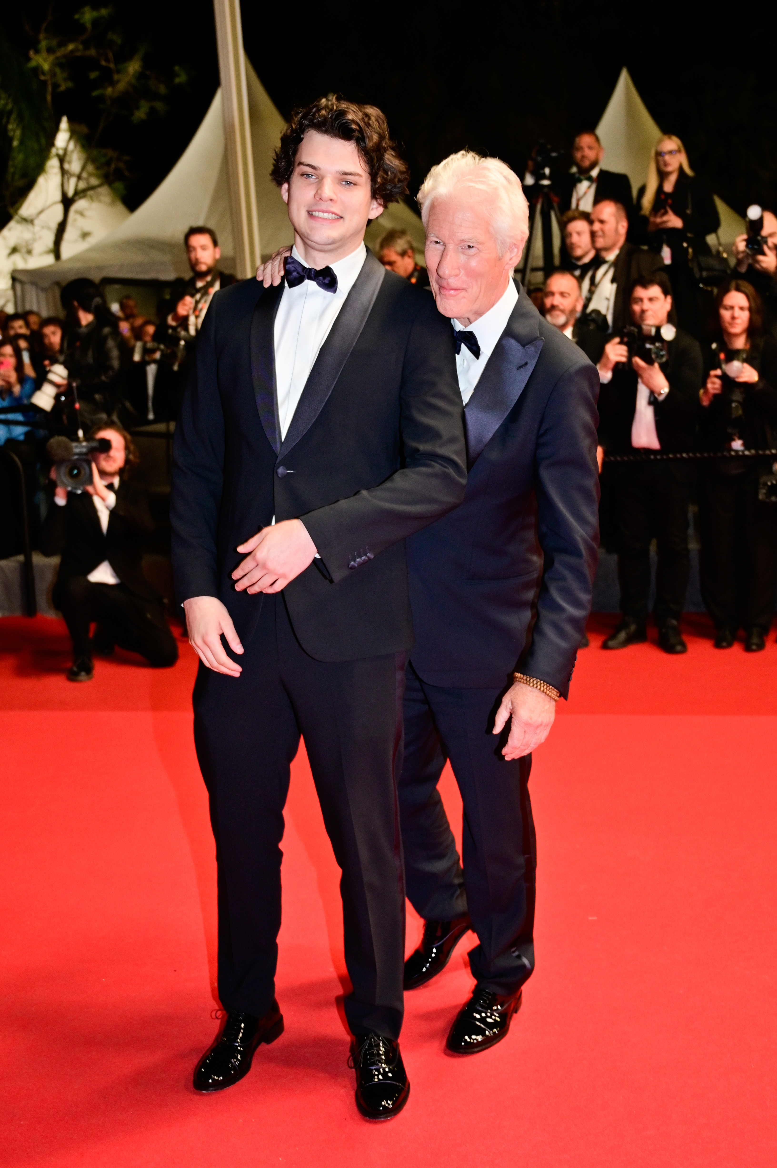 Homer James Jigme Gere and Richard Gere on the "Oh, Canada" red carpet during the 77th annual Cannes Film Festival in Cannes, France on May 17, 2024. | Source: Getty Images