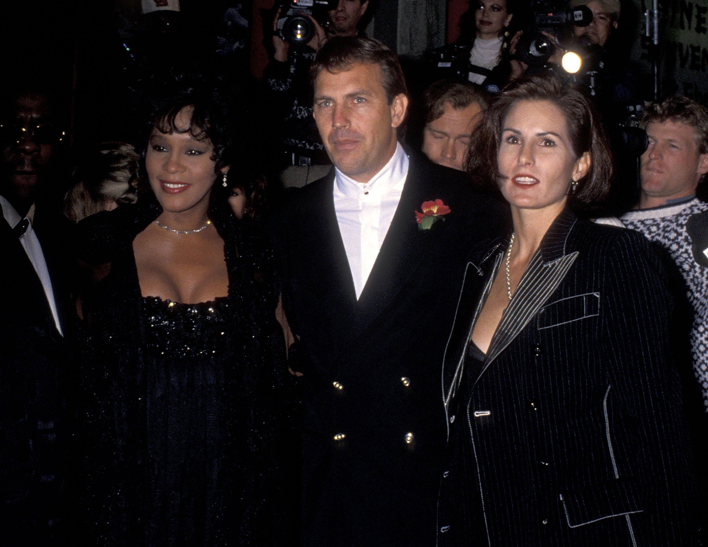 Whitney Houston, Kevin Costner, and Cindy Costner at the Hollywood premiere of "The Bodyguard," 1992 | Source: Getty Images