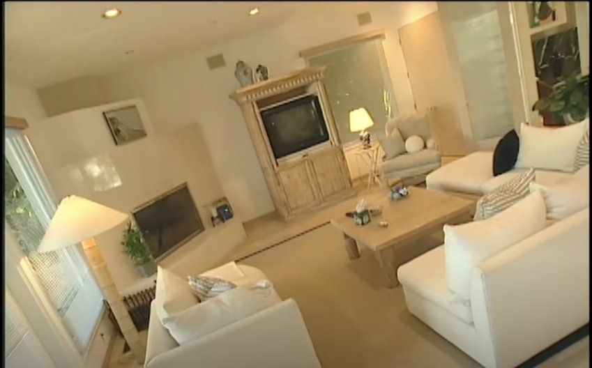 Simon Cowell showing off his first living area at his Los Angeles, California home on "MTV Cribs" in 2002 | Photo: YouTube/MTV Vault