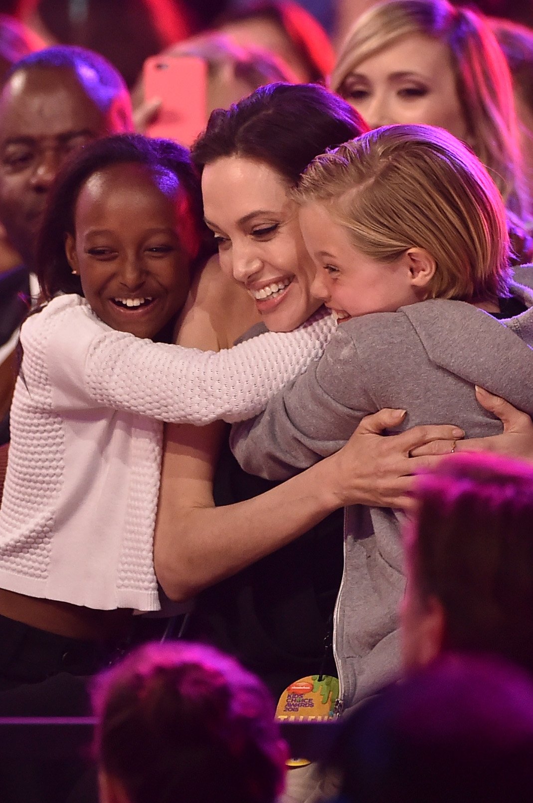  Actress Angelina Jolie hugs Zahara Marley Jolie-Pitt (L) and Shiloh Nouvel Jolie-Pitt (R) after winning award for Favorite Villain in 'Maleficent' during Nickelodeon's 28th Annual Kids' Choice Awards held at The Forum on March 28, 2015 in Inglewood, California | Source: Getty Images
