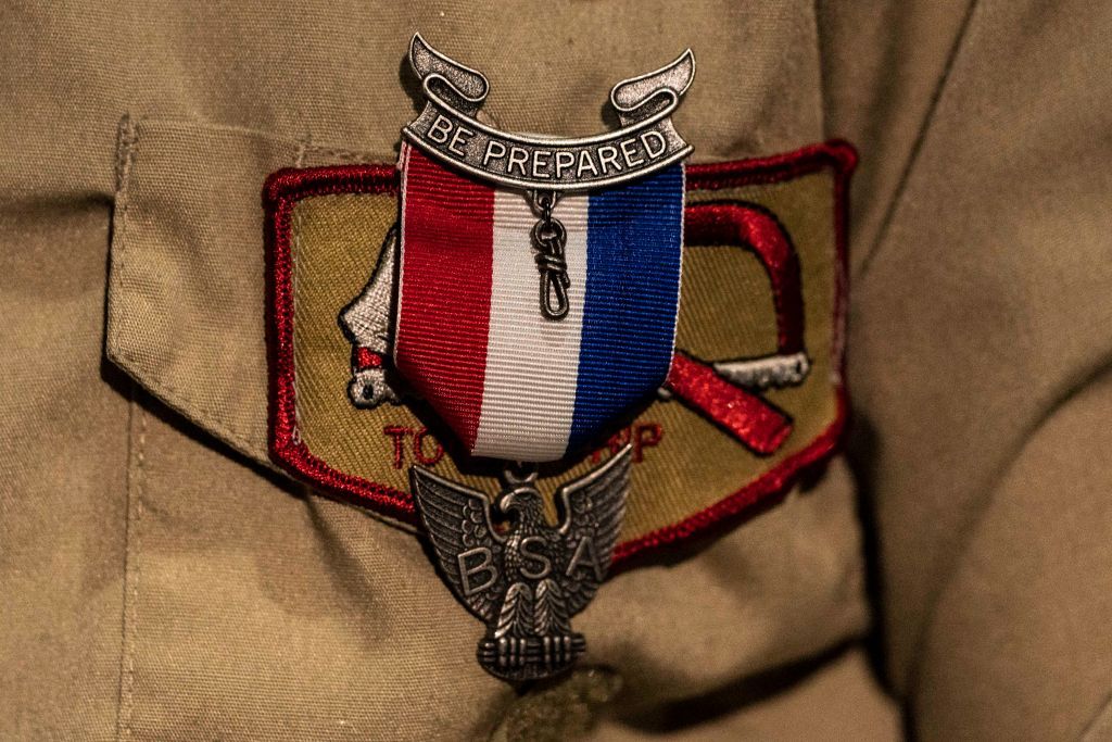 An Eagle Scout Award pinned to a female Scouts uniform during a ceremony recognizing the inaugural class of female Eagle Scouts at the Creighton Scouting Center, home of the Pacific Harbors Council of the Boy Scouts of America in Tacoma, Washington | Photo: David Ryder/Getty Images