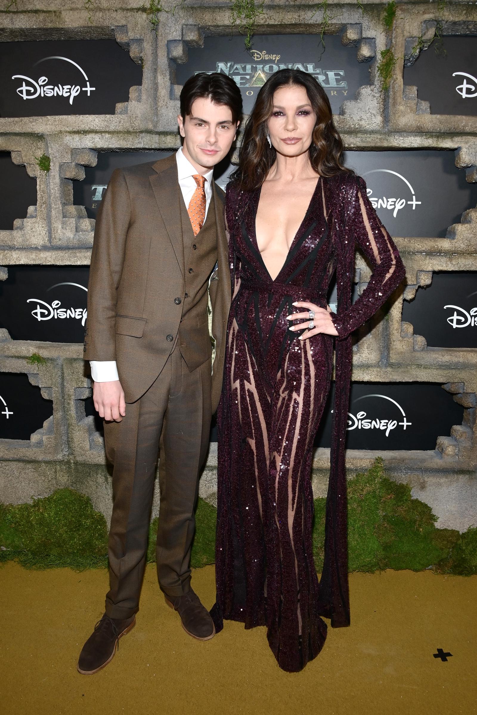 Dylan Michael Douglas and Catherine Zeta-Jones attend the premiere of Disney+ Original Series "National Treasure: Edge Of History" at El Capitan Theatre on December 05, 2022 in Los Angeles, California | Source: Getty Images