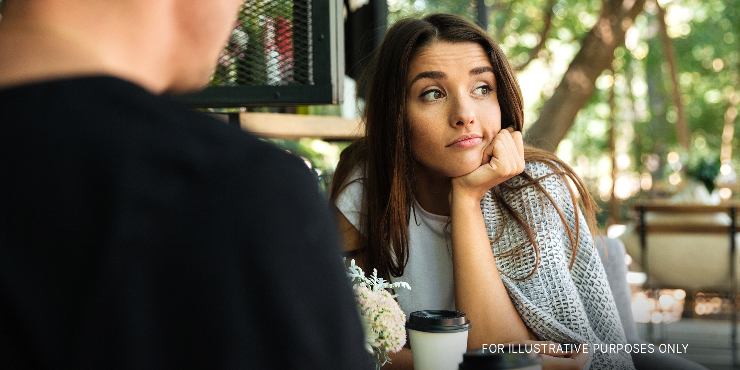 A woman bored during a date | Source: Shutterstock