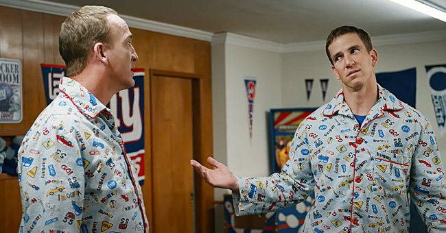 Eli and Peyton Manning in matching pajamas for a Super Bowl commercial, 2021. | Photo: youtube.com/OfficialFritoLay
