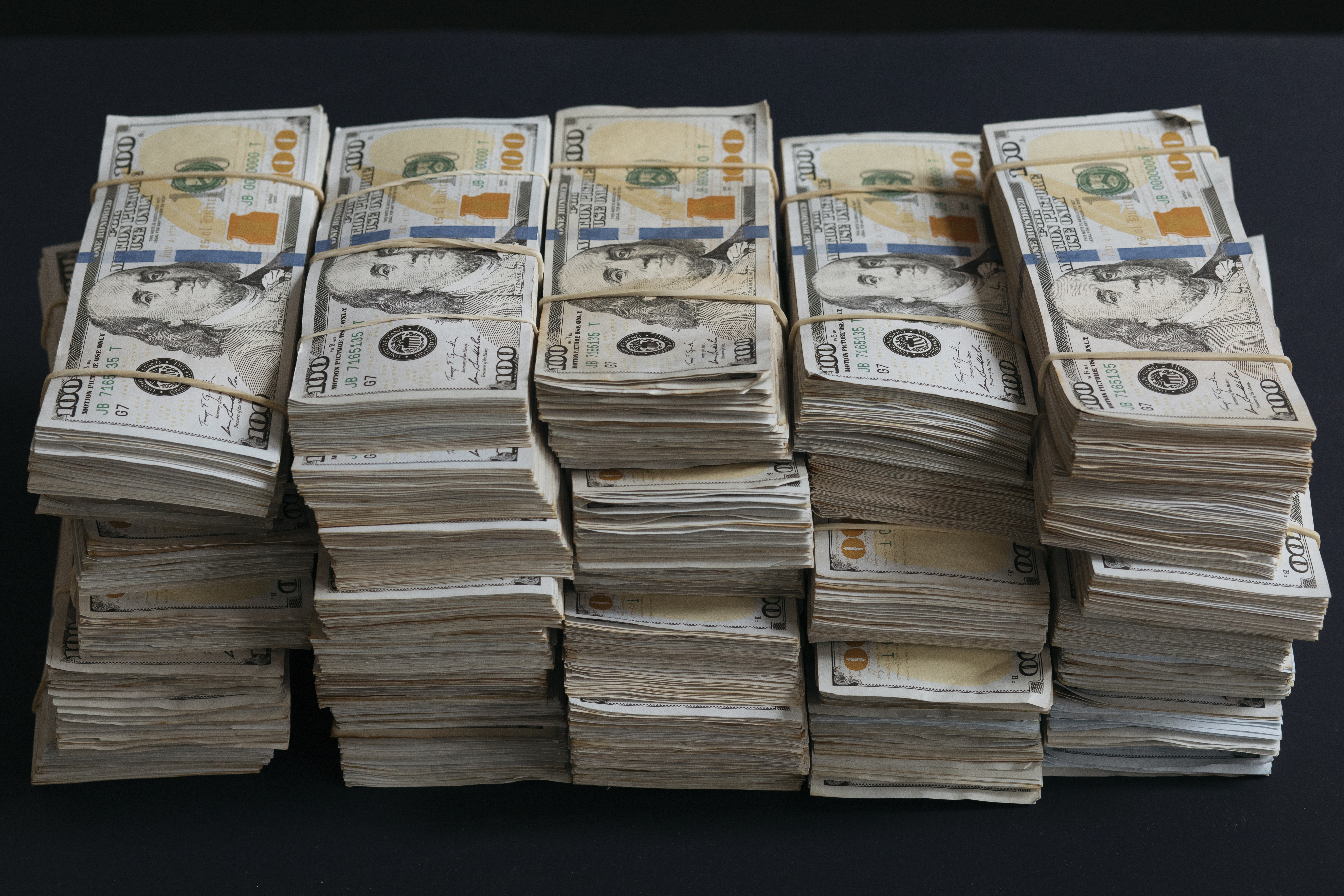 Stacks of money. | Source: Shutterstock