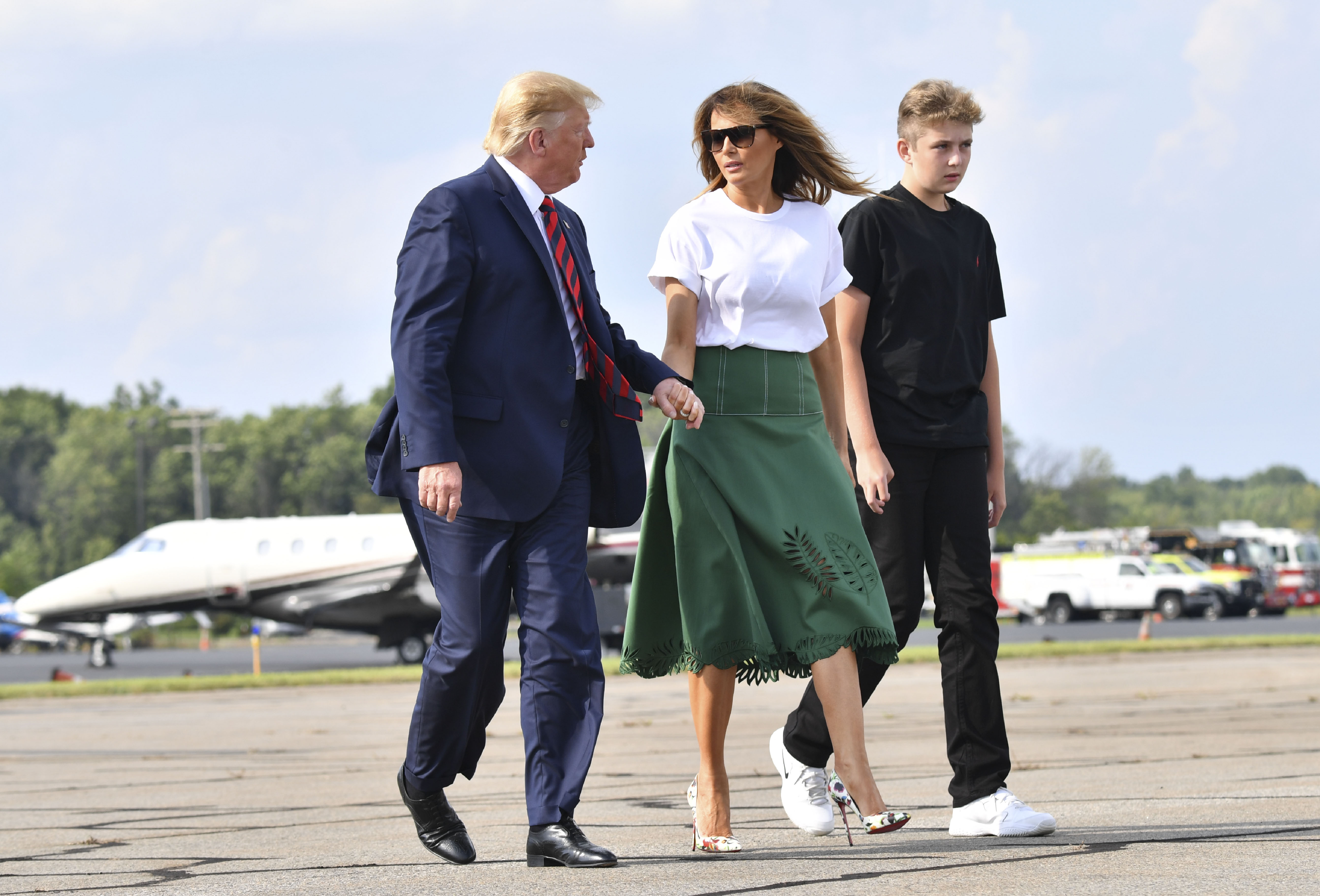 President Donald Trump, First Lady Melania Trump, and Barron Trump board Air Force One in Morristown, New Jersey, on August 18, 2019. | Source: Getty Images