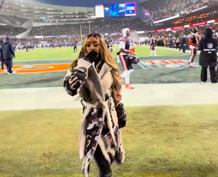 Simone Biles blowing a kiss to the camera before spinning around to show off her coat, posted on January 19, 2026. | Source: TikTok/@simonebilesowens