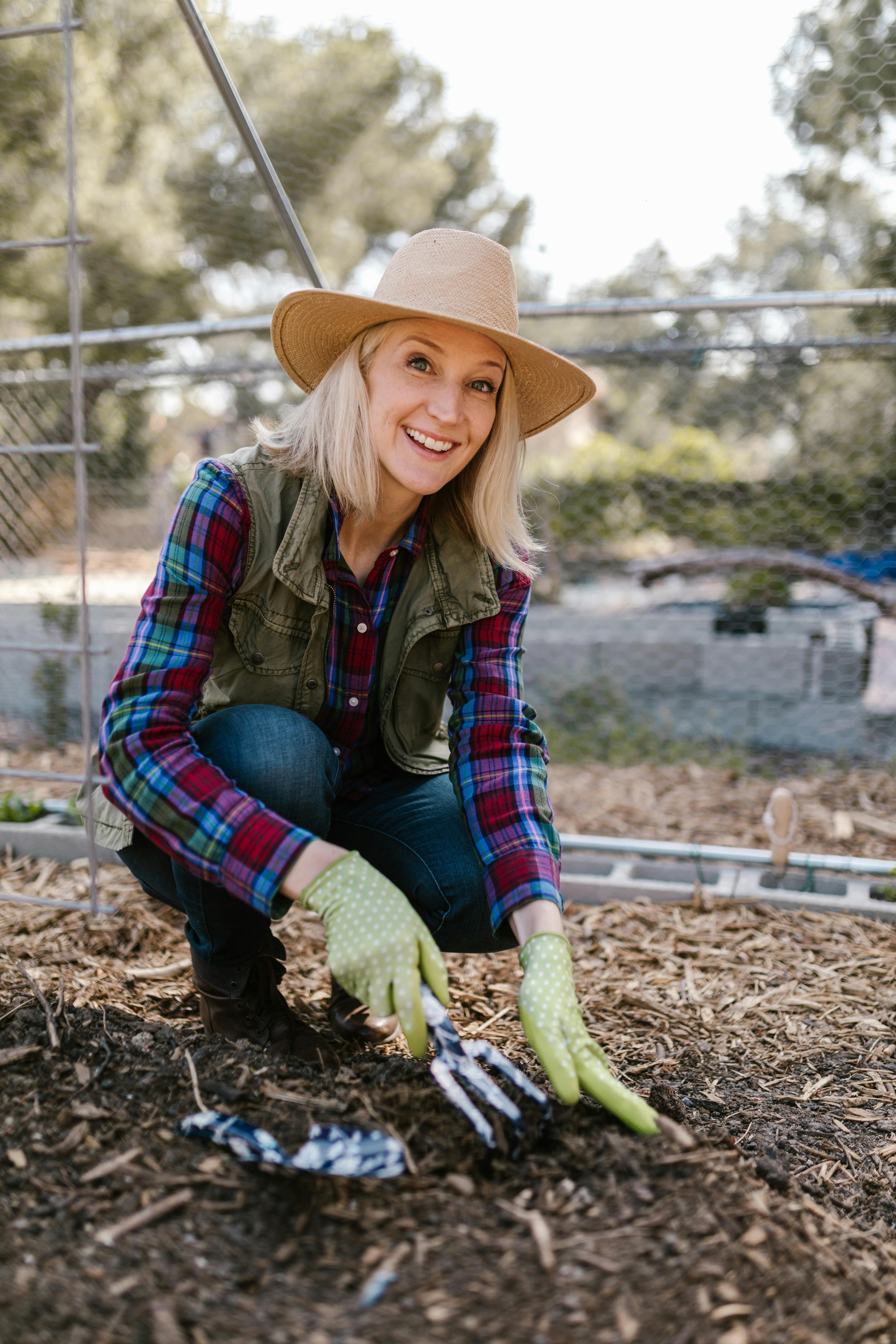 A woman checking her soil | Source: Pexels
