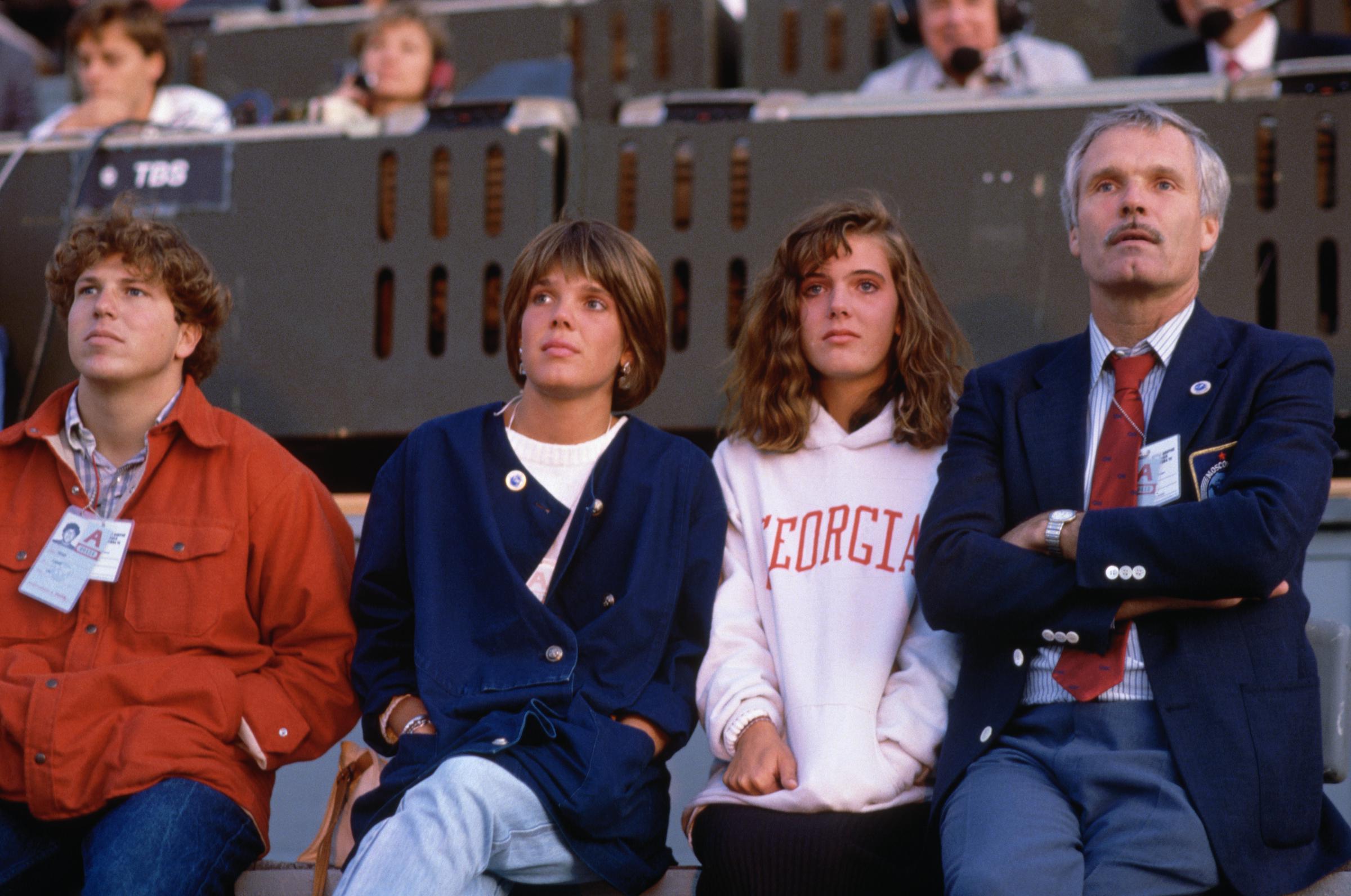 Ted Turner sits with his family during the 1986 Goodwill Games, which he sponsored and founded that same year | Source: Getty Images