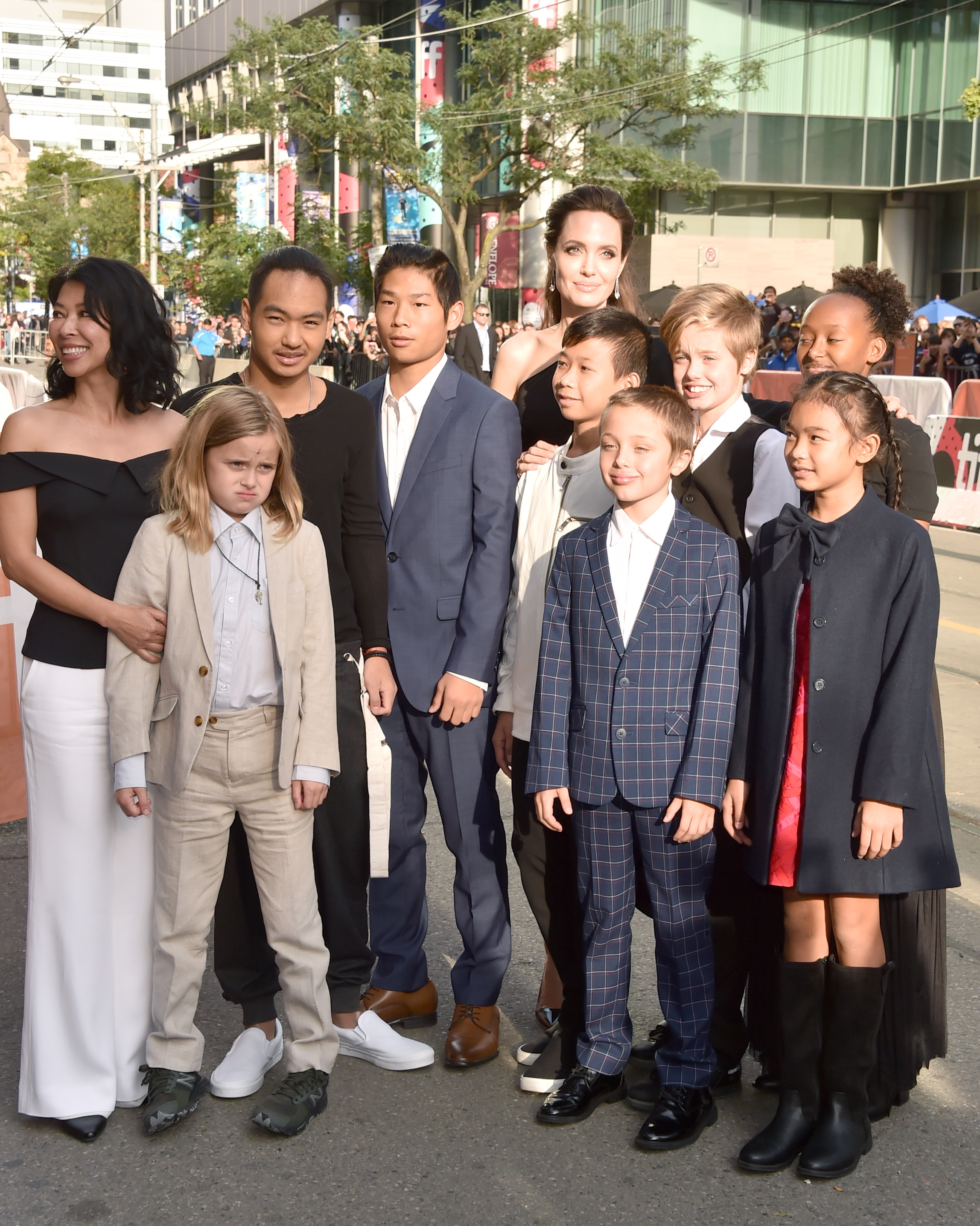 Loung Ung, Vivienne Jolie, Maddox Jolie, Pax Jolie-Pitt, Kimhak Mun, Knox Jolie-Pitt, Shiloh Jolie, Angelina Jolie, Zahara Jolie, and Sareum Srey Moch attend the "First They Killed My Father" premiere during the Toronto International Film Festival at Princess of Wales Theatre on September 11, 2017, in Toronto, Canada.
