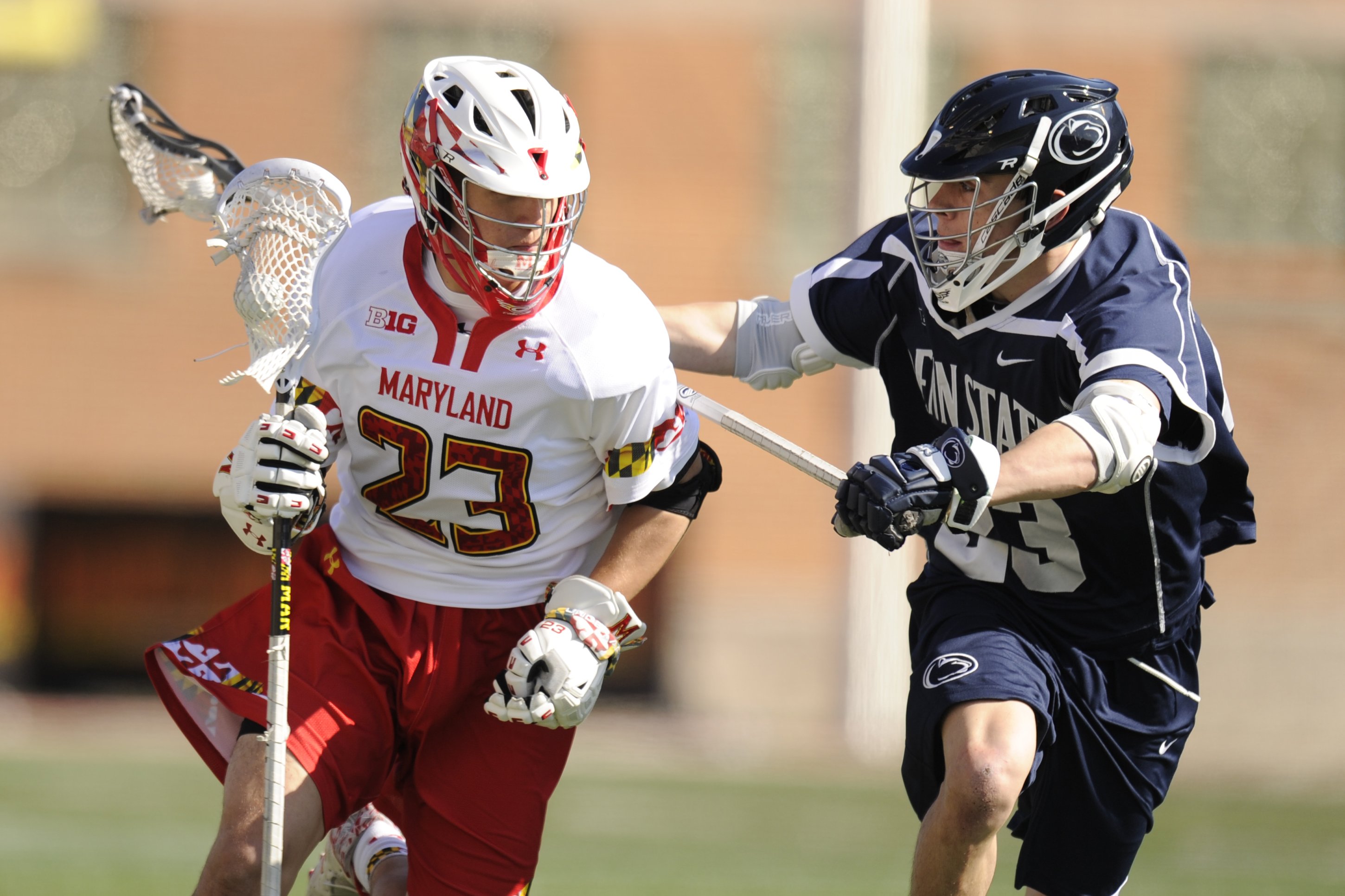 James Burke in blue jersey number #23 and Adam DiMillo in red and white jersey #23 pictured during a lacrosse game at Capital One Field at Byrd Stadium on April 4, 2015, in College Park. | Source: Getty Images