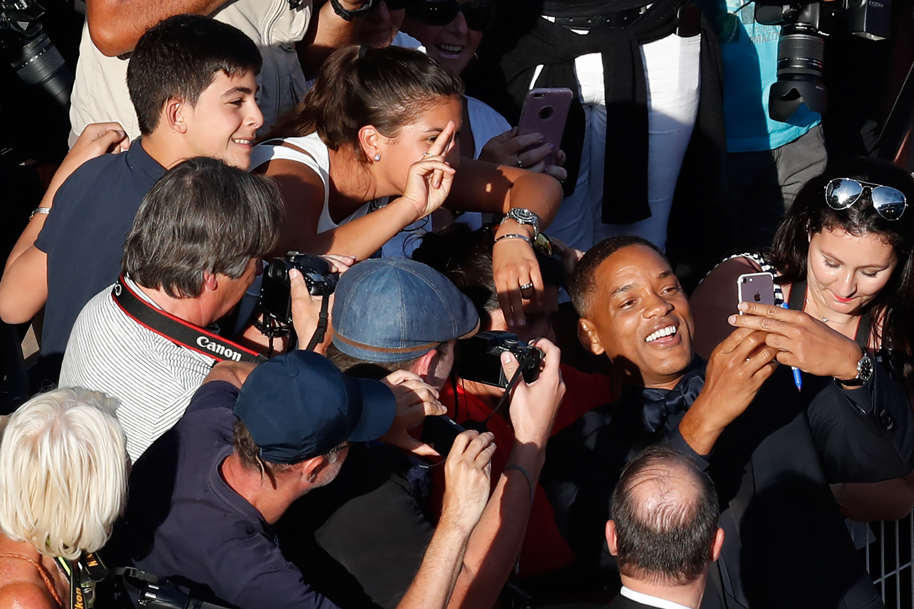 Will Smith taking selfies with fans at the Cannes Film Festival in 2017 | Source: Getty Images