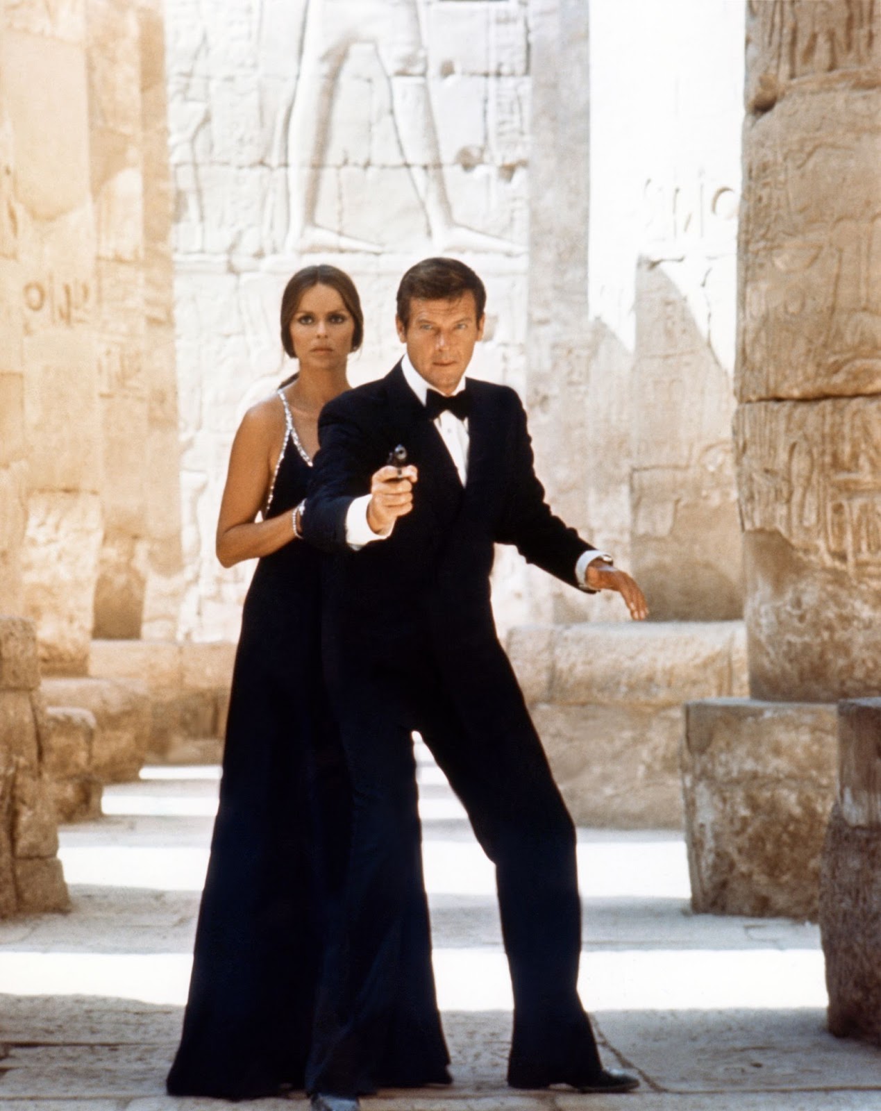 The star and Roger Moore on the set of "The Spy Who Love Me" in 1977 | Source: Getty Images