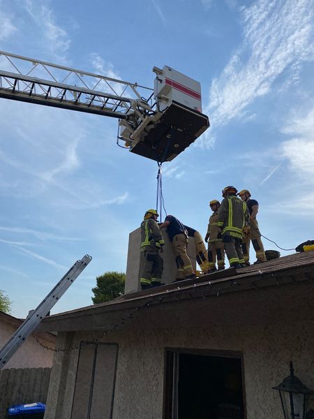Firemen rescu teen stuck in the chimney | Source: Facebook/Henderson Fire Department