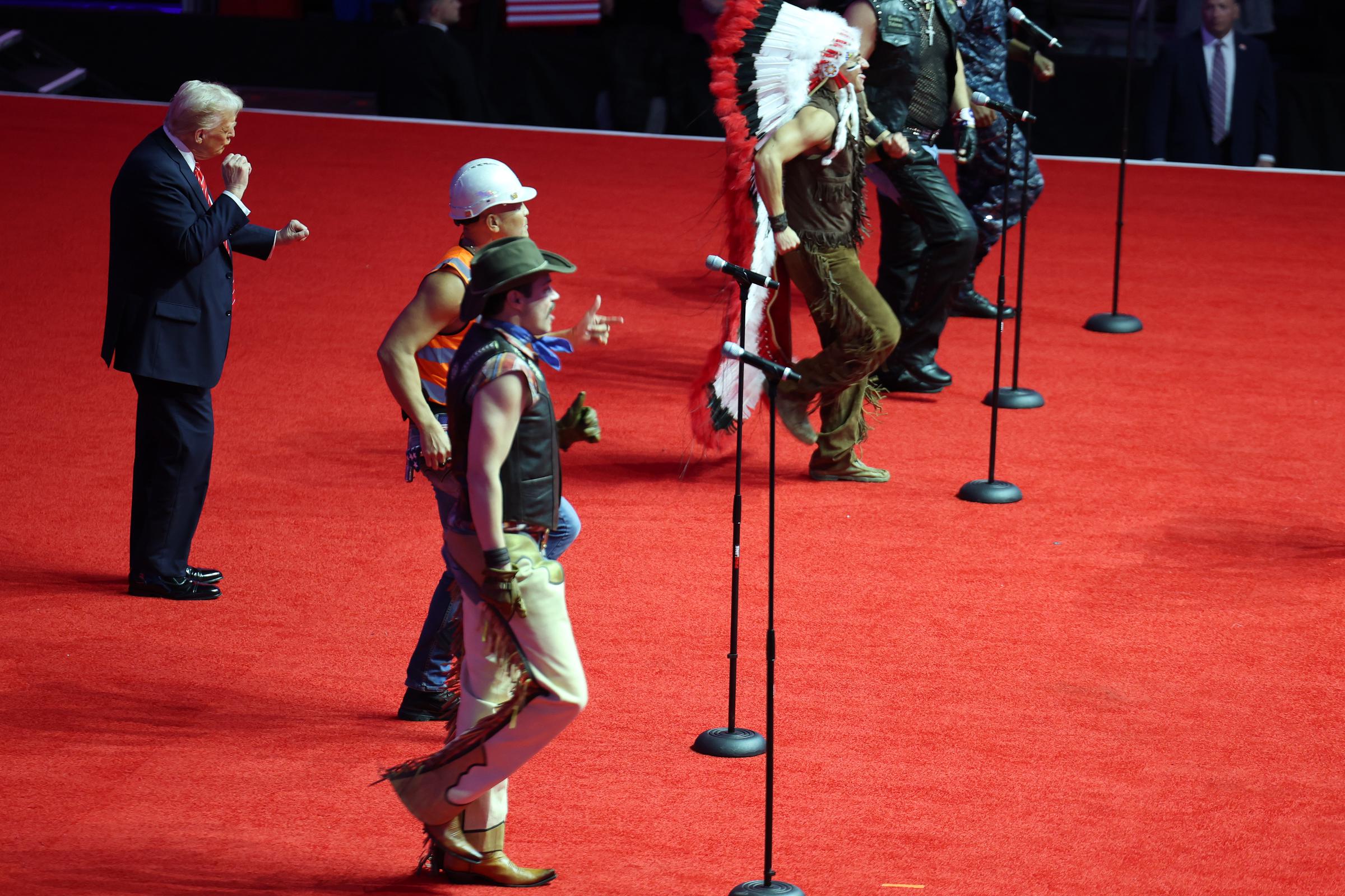 Donald Trump dances on stage while the Village People perform "YMCA" on stage at his victory rally at the Capital One Arena on January 19, 2025 in Washington, DC | Source: Getty Images