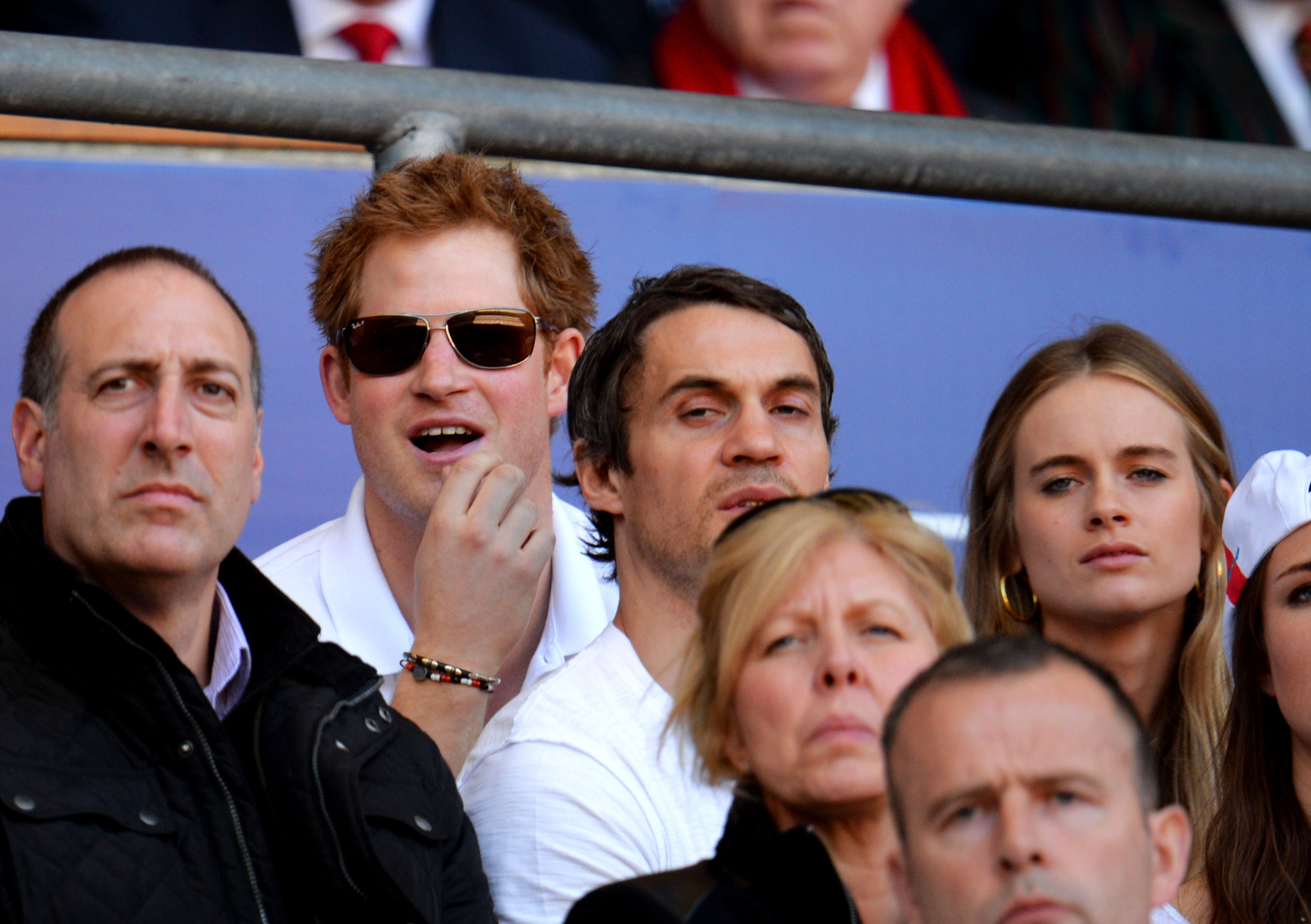 Prince Harry and Cressida Bonas look on during the RBS Six Nations match at Twickenham Stadium on March 9, 2014 in London, England. | Source: Getty Images