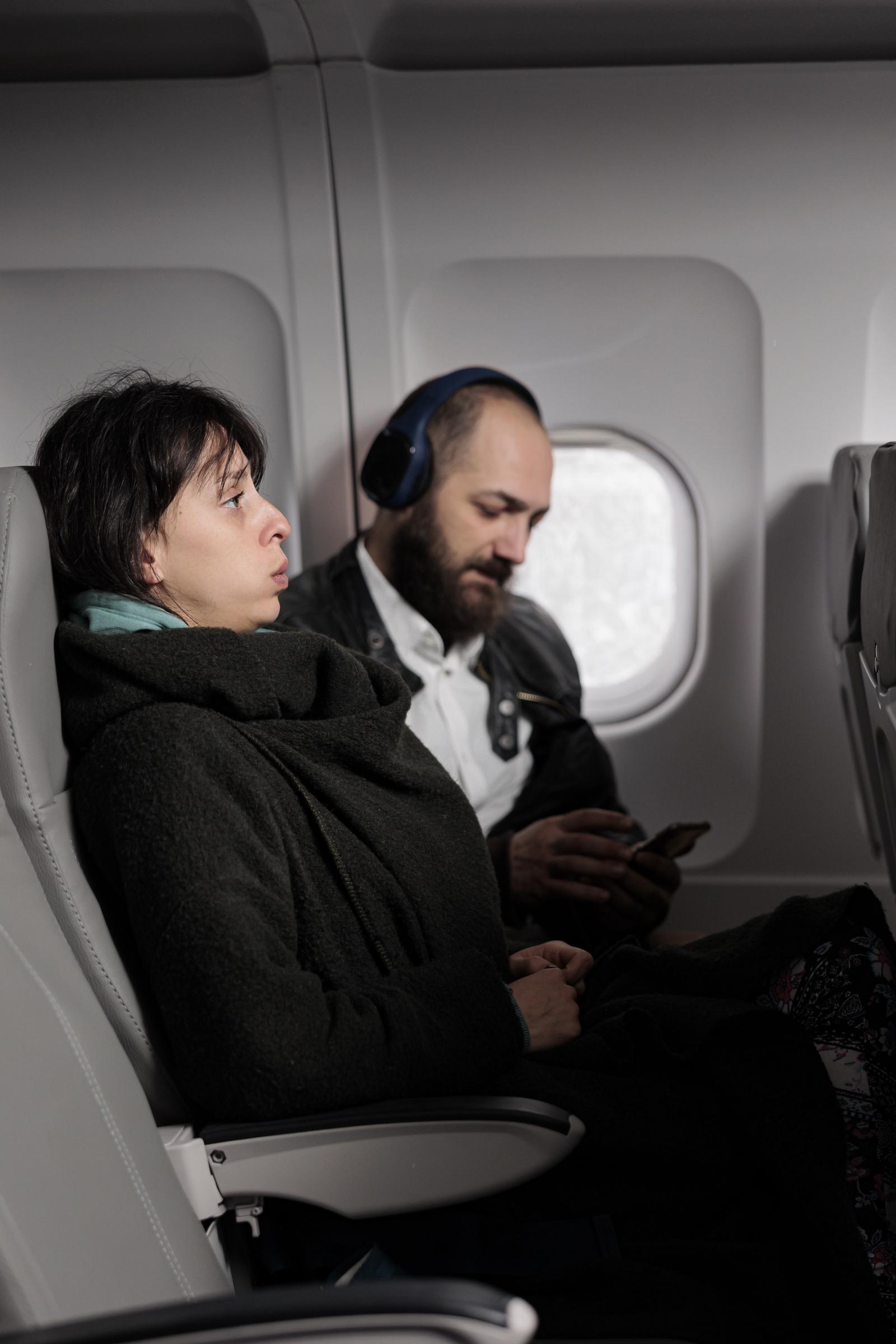 A couple in an airplane | Source: Freepik