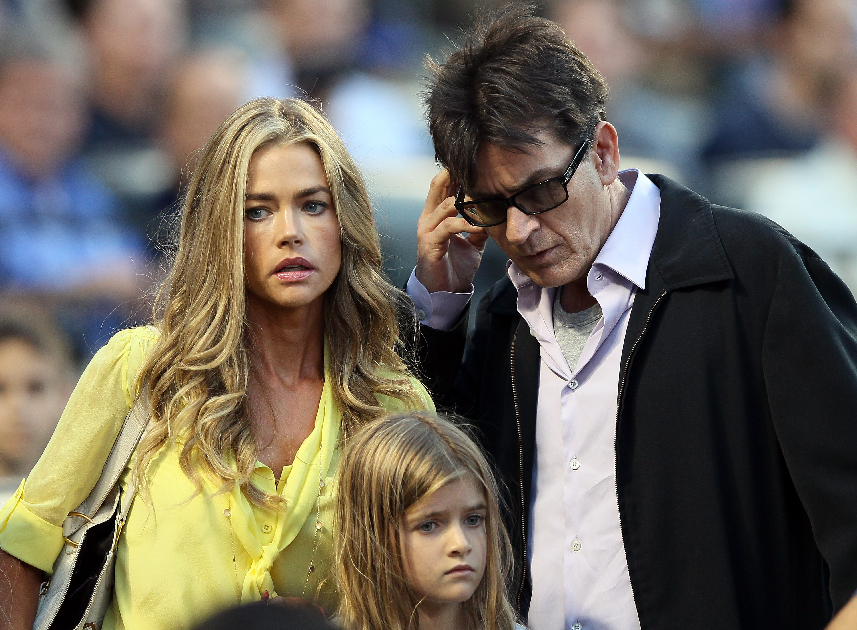 Denise Richards and Charlie Sheen with one their daughter in New York in 2012 | Source: Getty Images