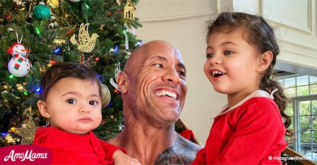 Dwayne Johnson holds little daughters while saying he will protect them for the rest of his life